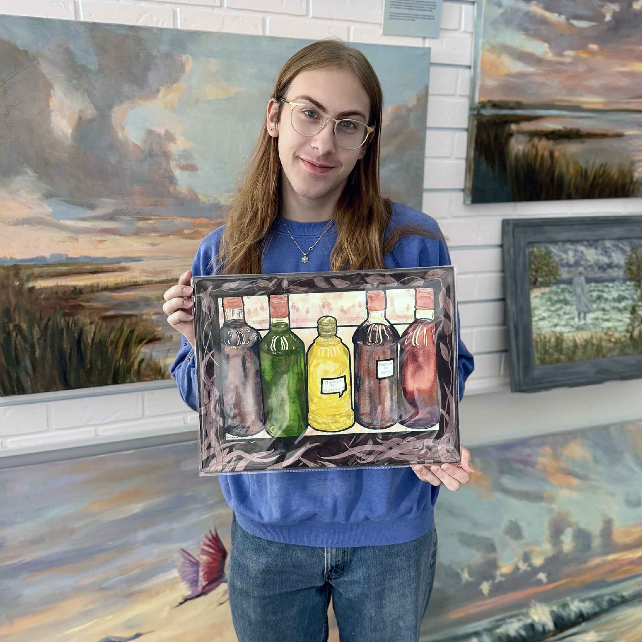A Gray Man Gallery team member holds Mistela by Mimi Beaver, an original watercolor featuring a row of hand-painted glass bottles in jewel tones, donated to support Salty Dogs Senior Animal Rescue.