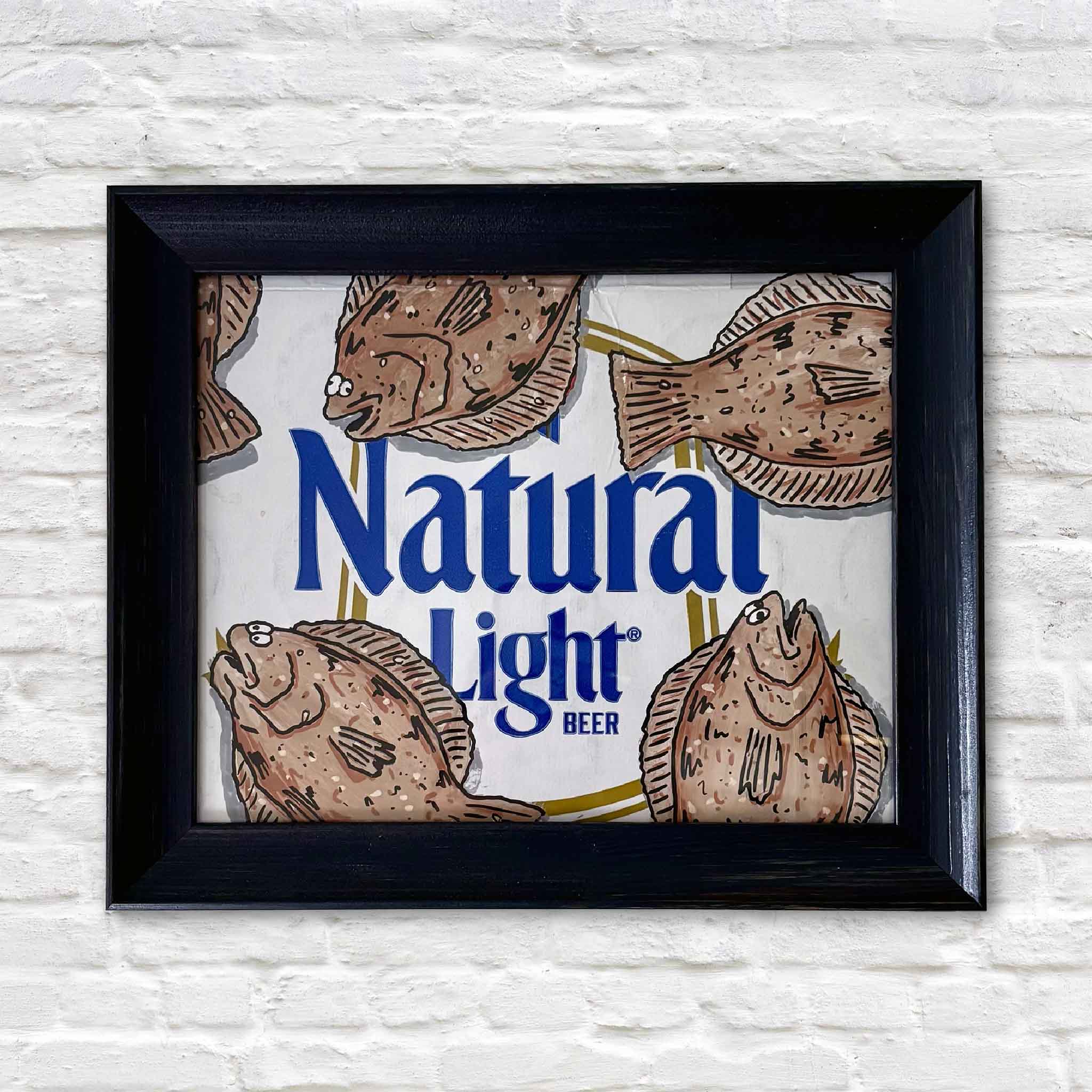 Floundahs 'n Poundahs by Charleston artist Nick Kawczynski features hand-painted flounder surrounding a reclaimed Natural Light beer box. This original mixed media artwork is professionally framed in navy blue and available at Gray Man Gallery in Pawleys Island, South Carolina.