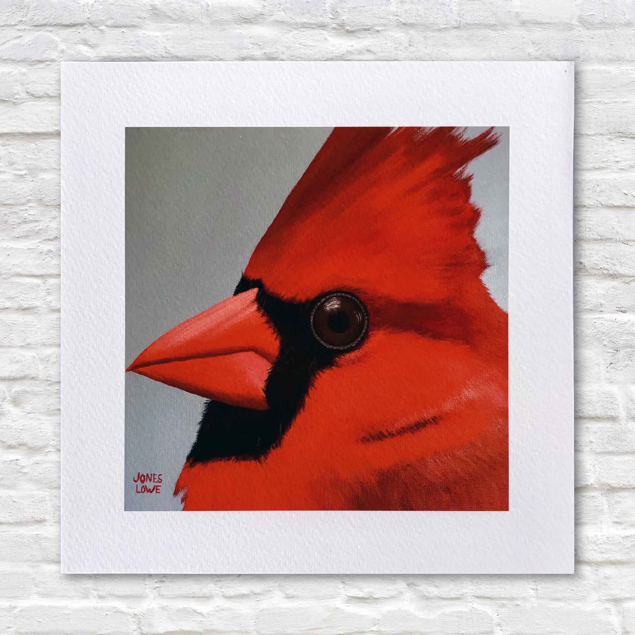 Northern Cardinal II bird print by Georgetown local artist Nancy Jones Lowe featuring a vibrant close-up portrait of a brilliant red cardinal. Professionally printed on 100% cotton archival fine art paper with archival pigment inks in an 8×8 size that fits any standard 8×8 frame without custom framing, available at Gray Man Gallery in Pawleys Island.