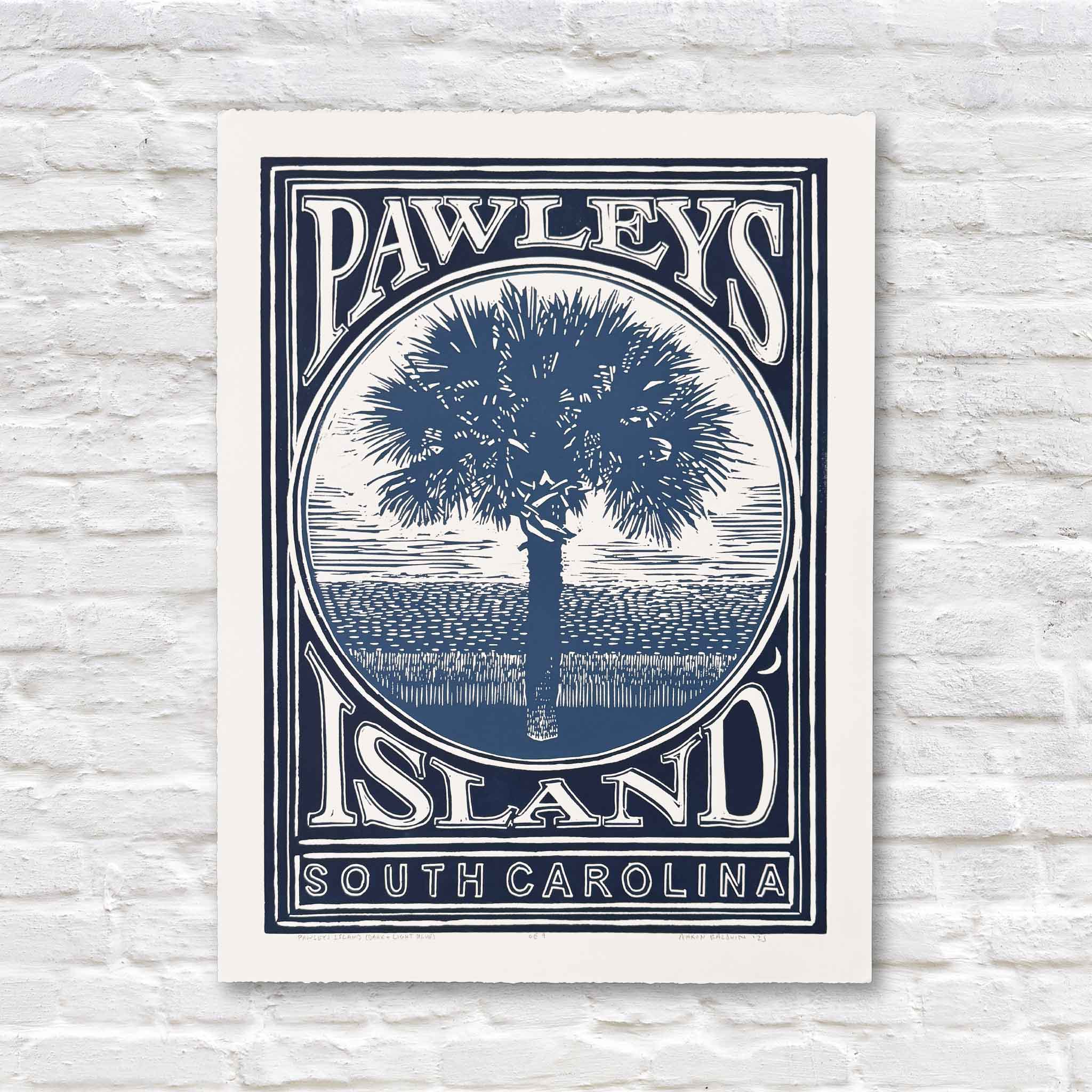 Pawleys Island linocut print by Aaron Baldwin in both dark blue and light blue ink, with a palmetto tree and coastal marsh details.