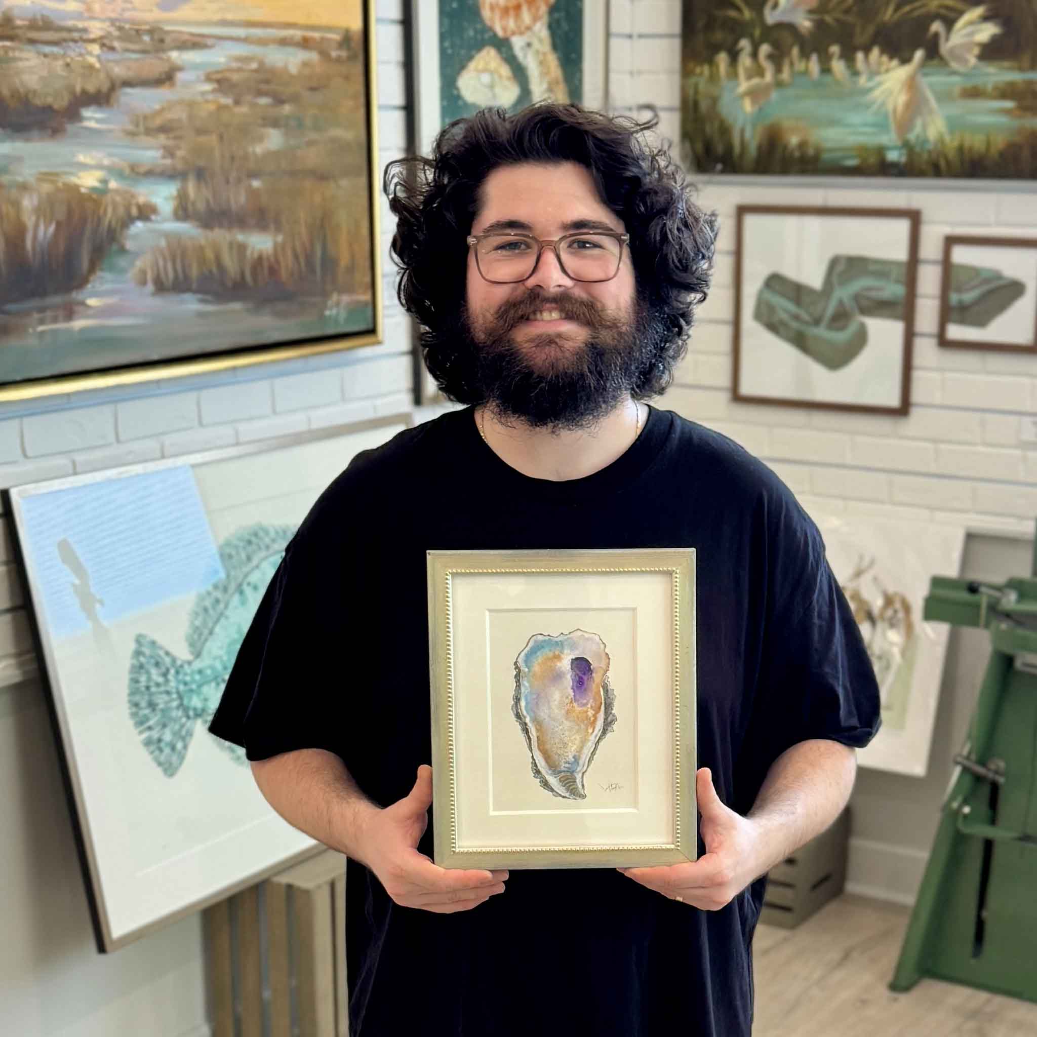 Pawleys Oyster VIII original watercolor by Pawleys Island artist Vida Miller, depicting a single Lowcountry oyster shell with rich violet, turquoise blue, lavender, warm ochre, rust, cream, and gray watercolor washes, professionally matted and finished in an antiqued metallic beaded frame at Gray Man Gallery in Pawleys Island, South Carolina.