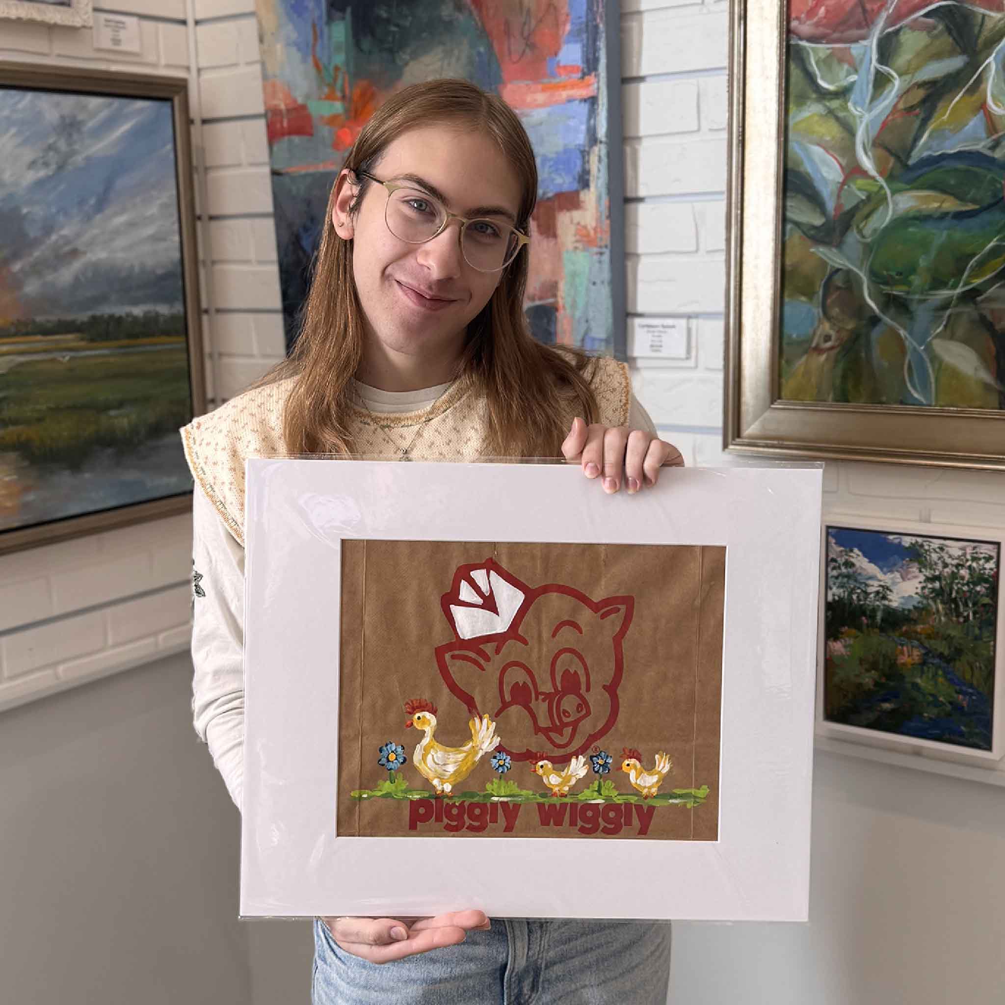 Side view of the original “Mama Hen & Chicks” Piggly Wiggly artwork, showing texture and painted details on the kraft paper surface.