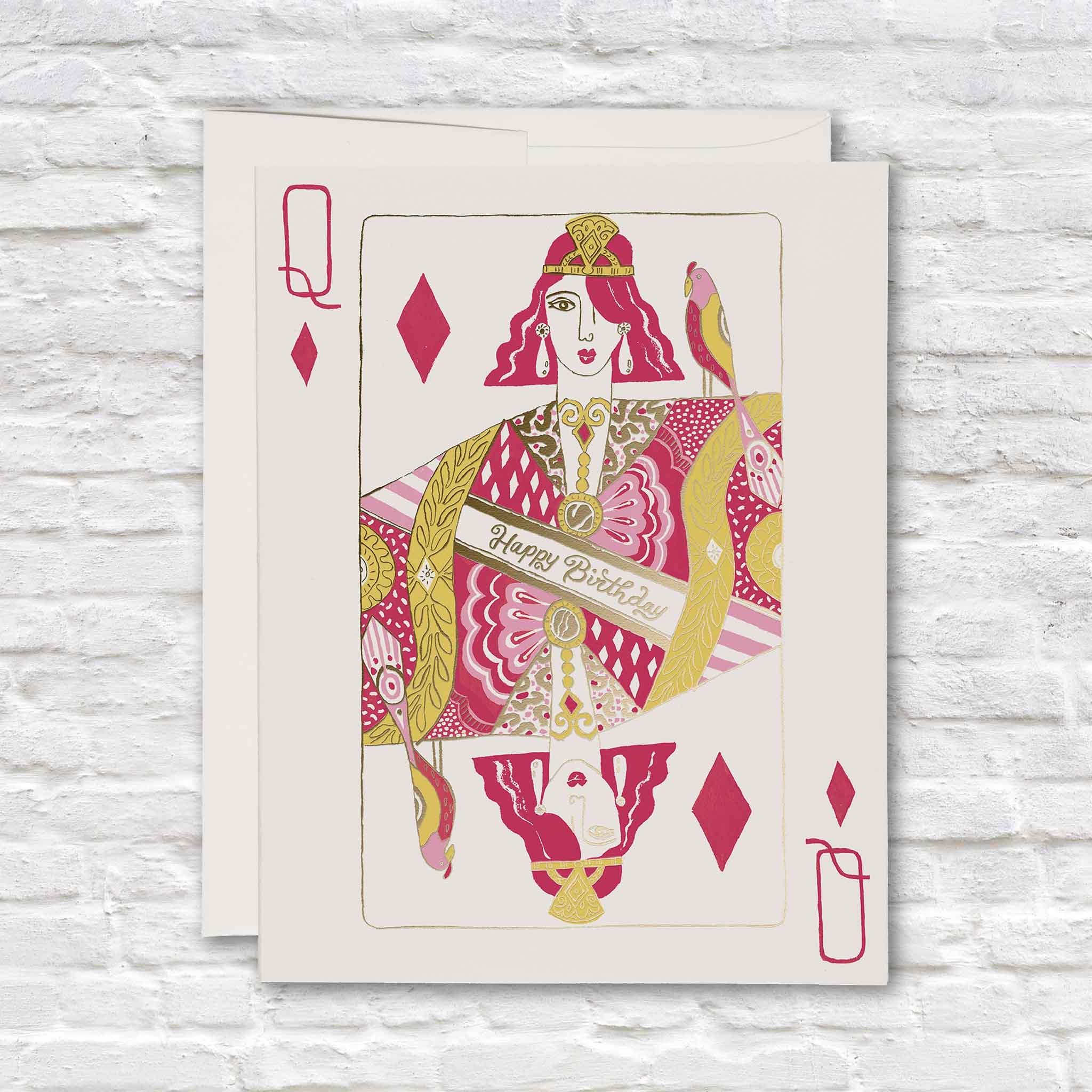 Queen of Diamonds birthday card for her featuring a colorful illustrated playing card queen in hot pink and metallic gold foil with a “Happy Birthday” sash, photographed at Gray Man Gallery in Pawleys Island, South Carolina.