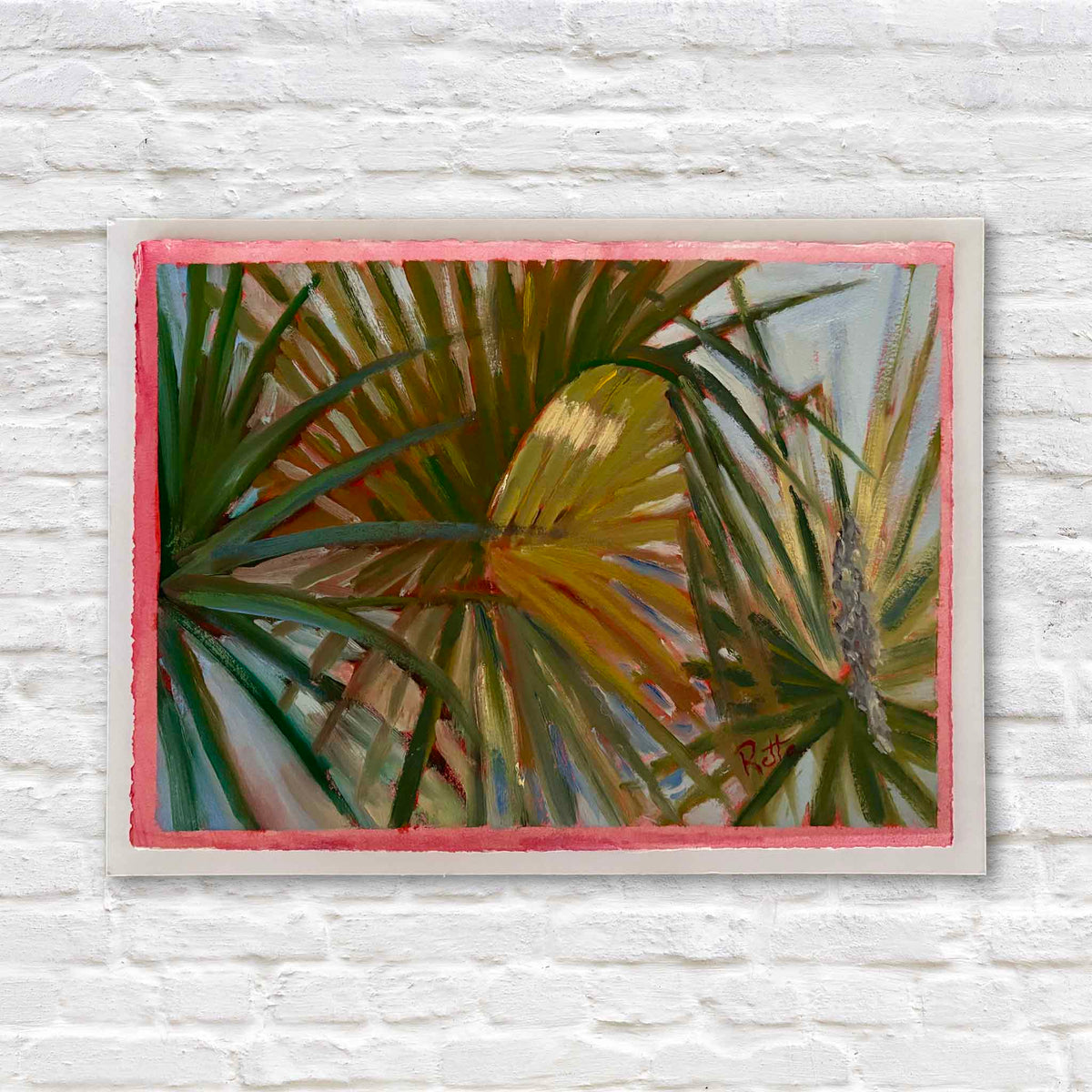 Palmetto Fronds #212 original oil on paper by local artist Retta Dotterer featuring layered South Carolina palmetto leaves in green, gold and blue with a hand-painted pink border, available at Gray Man Gallery in Pawleys Island.