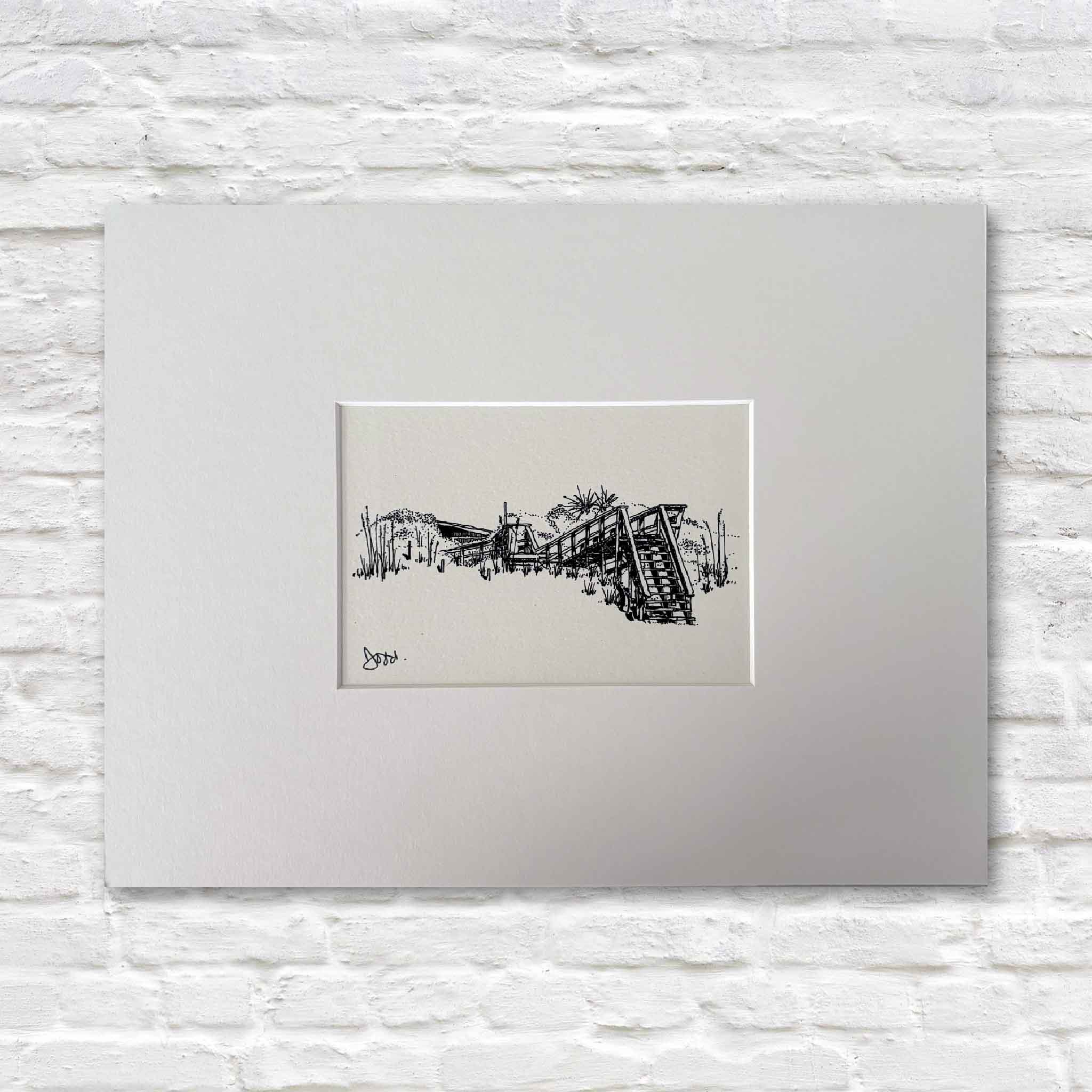 Todd Halamka's Pawleys Beach House Boardwalk pen-and-ink print, professionally matted to a standard 11x14 size and available at Gray Man Gallery in Pawleys Island, South Carolina. The detailed illustration captures a classic Pawleys Island beach house boardwalk leading through the dunes toward the ocean and fits any standard 11x14 ready-made frame.