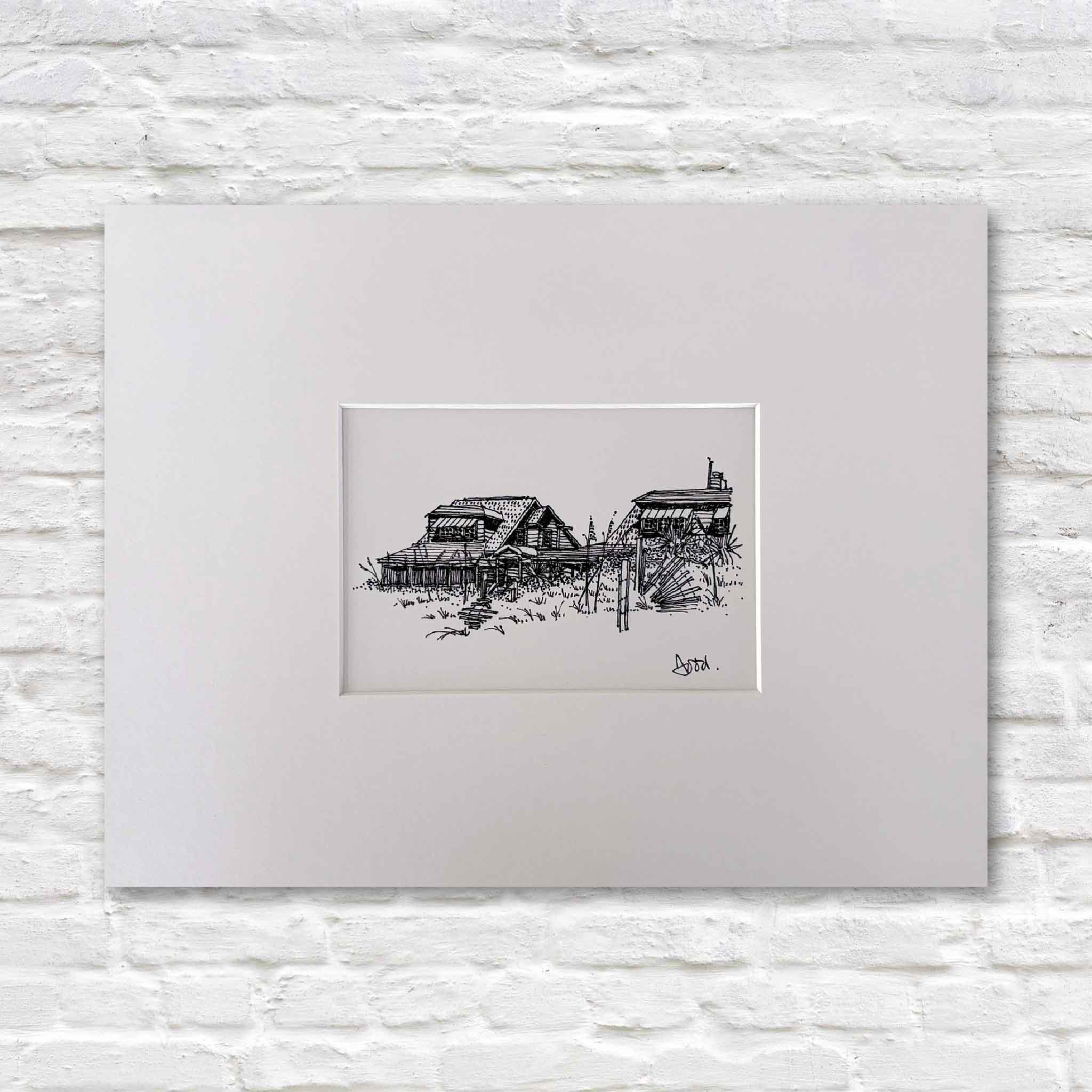 Pawleys Island Beach Houses by Todd Halamka, a detailed pen-and-ink print depicting classic beach homes nestled among sea oats and dune grasses on Pawleys Island, South Carolina. Professionally matted by Gray Man Gallery to fit a standard 11x14 frame, this nostalgic coastal artwork celebrates the charm and character of Old Pawleys.