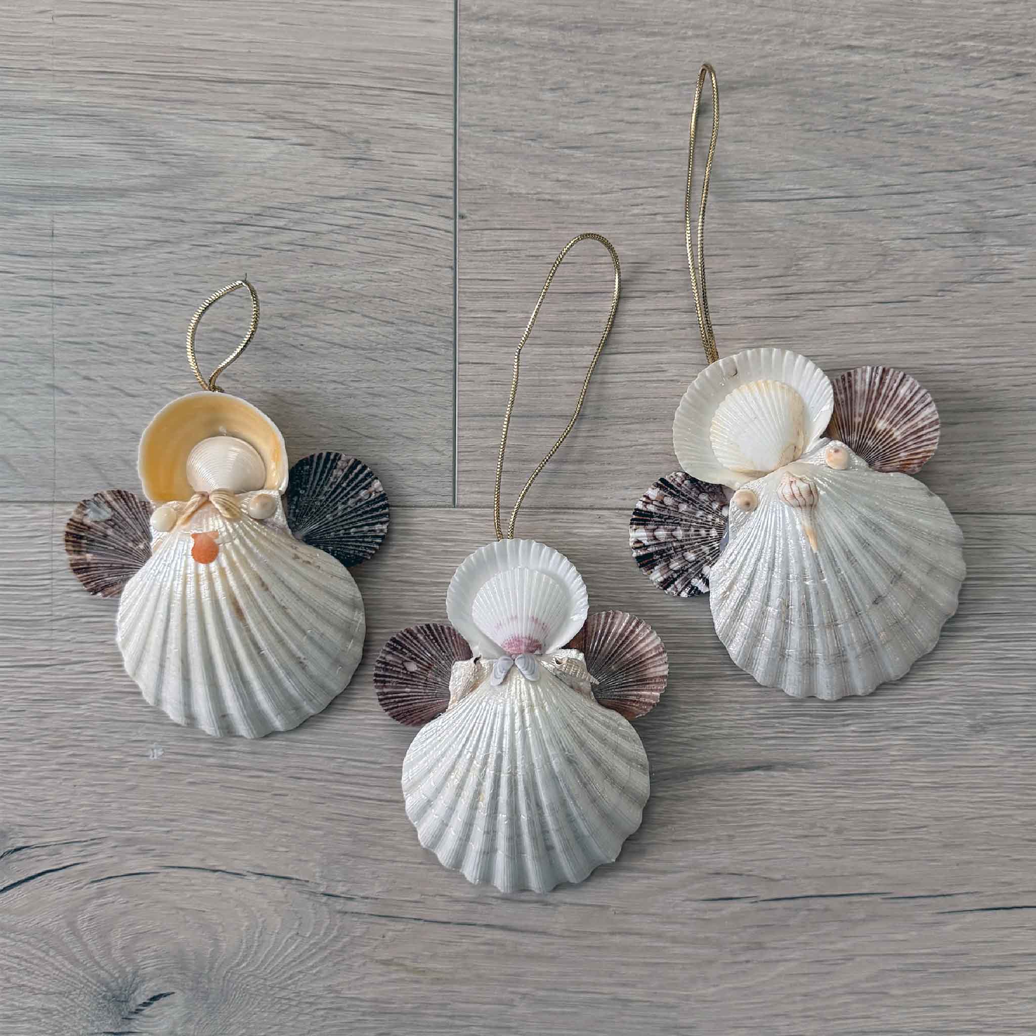 A close-up of the handmade shell angel ornament, highlighting the layered shells that form its wings, gown, and halo.