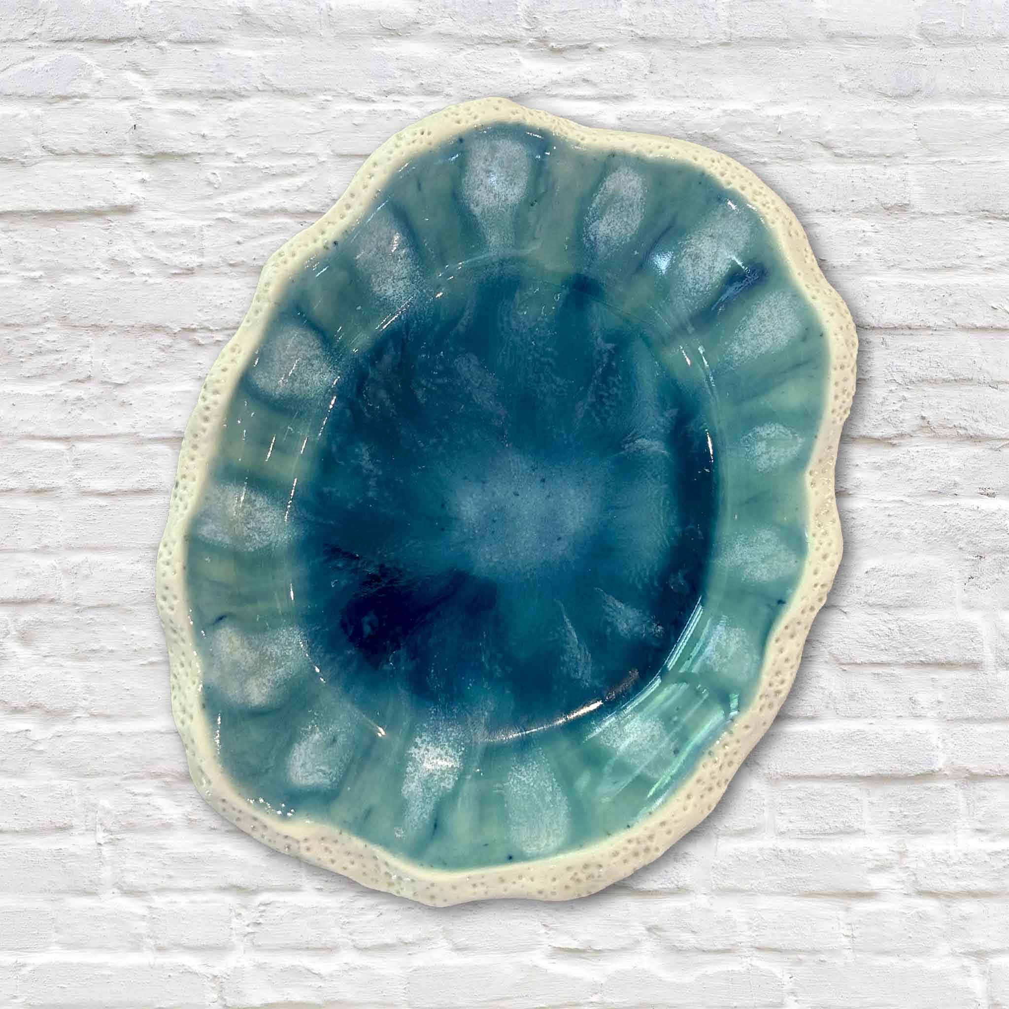 Handmade Marsh Drift Bowl by Pawleys Island artist Vida Miller featuring layered turquoise, celadon, and deep blue glazes with an organically scalloped rim. Each ceramic bowl is individually shaped and fired, making every piece uniquely one of a kind, available at Gray Man Gallery in Pawleys Island, South Carolina.
