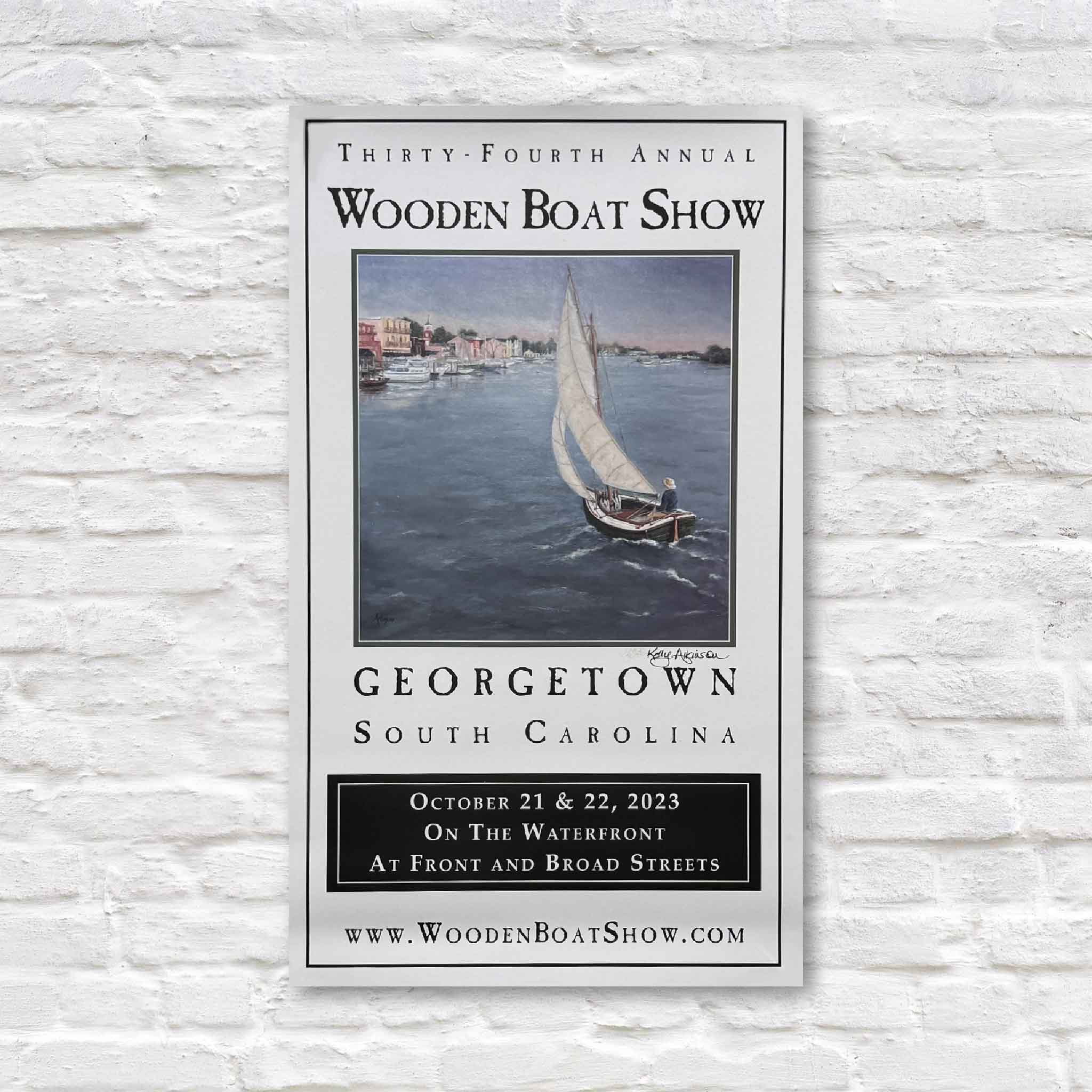 2023 Georgetown Wooden Boat Show poster featuring a sailboat on the harbor, artwork by Kelly Atkinson, signed by the artist.