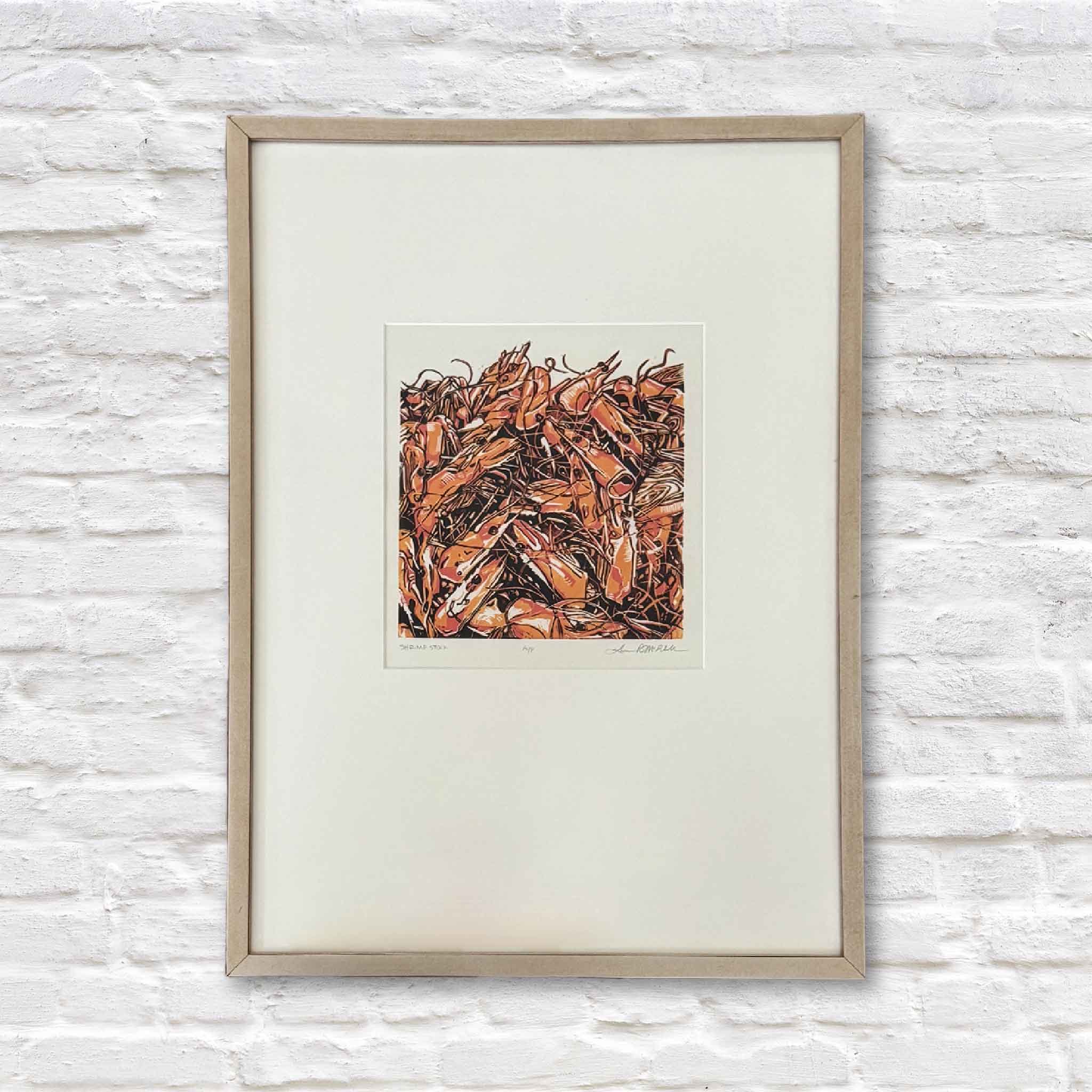 Shrimp Stock is an original linocut reduction print by local artist Laurie McIntosh, matted and framed. 
