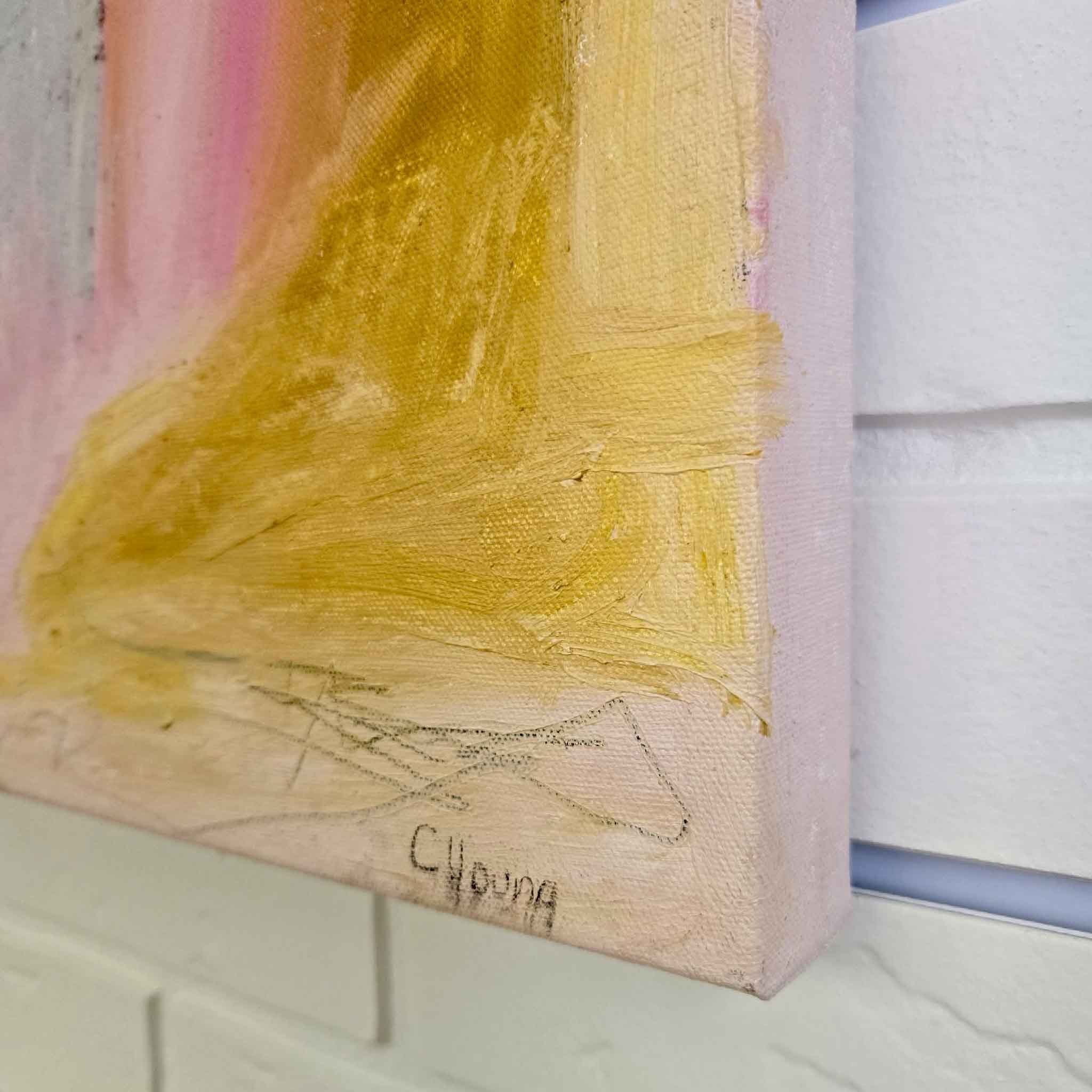 Close-up of a painting corner with visible texture and signature on a light background