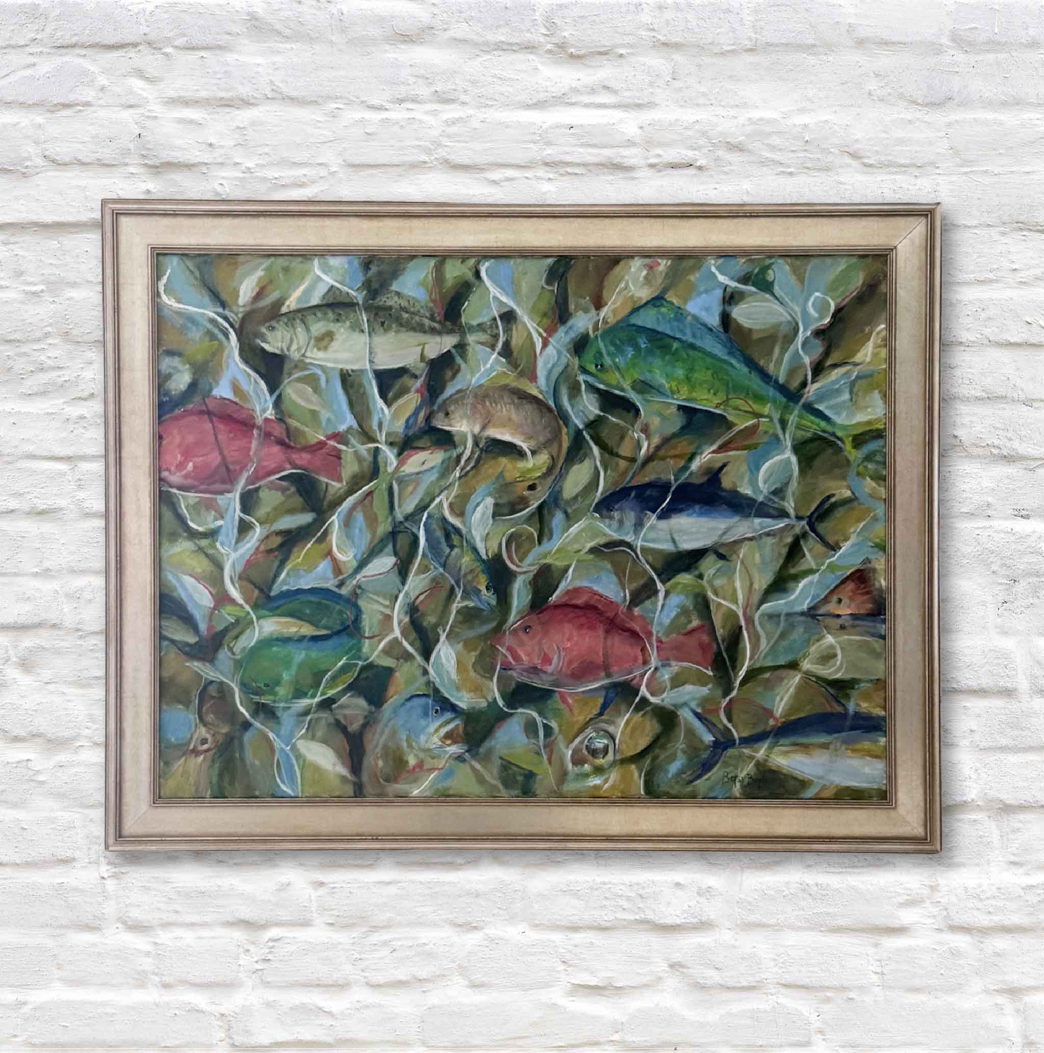 Framed painting of fish and underwater plants on a white brick wall