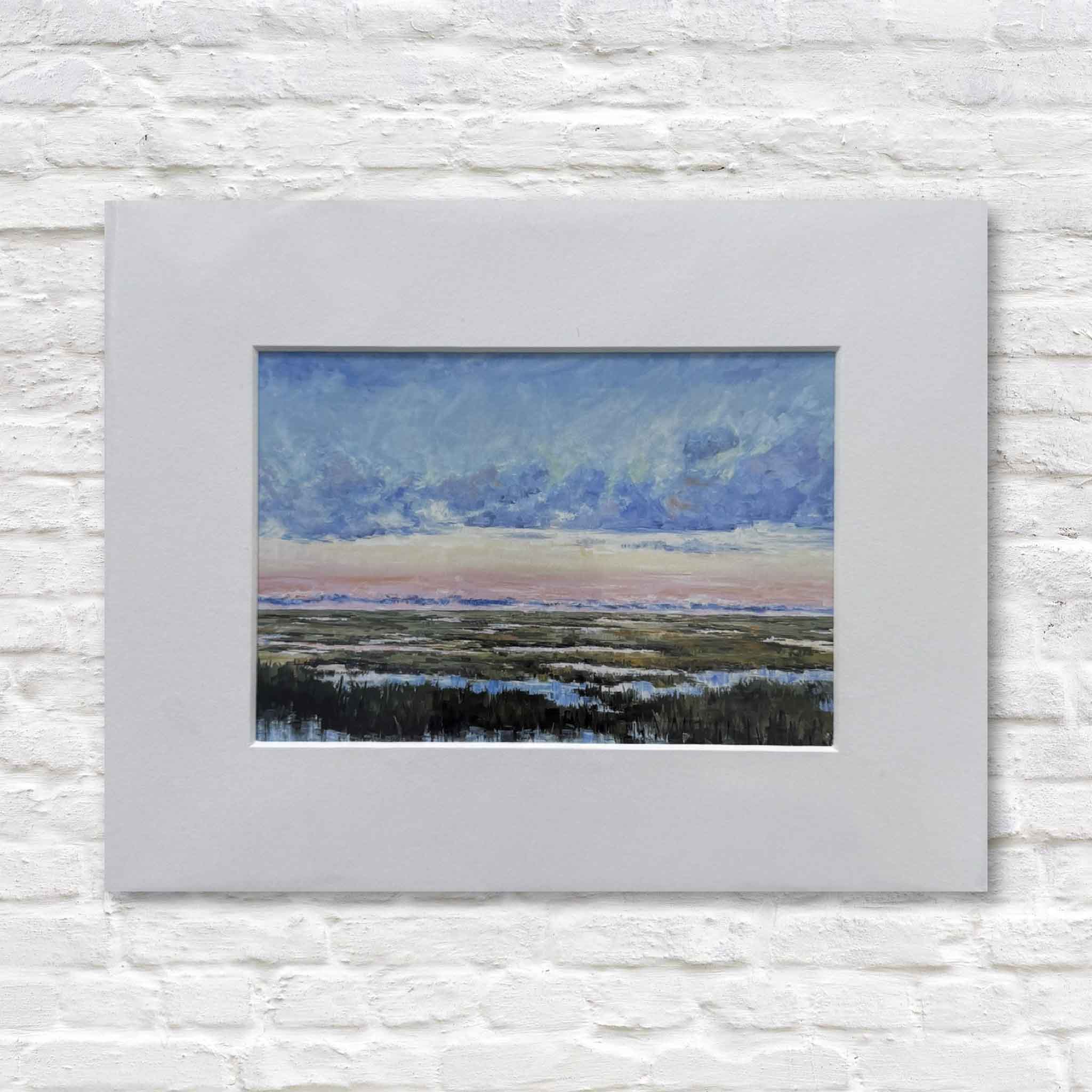 matted landscape painting on a textured white wall
