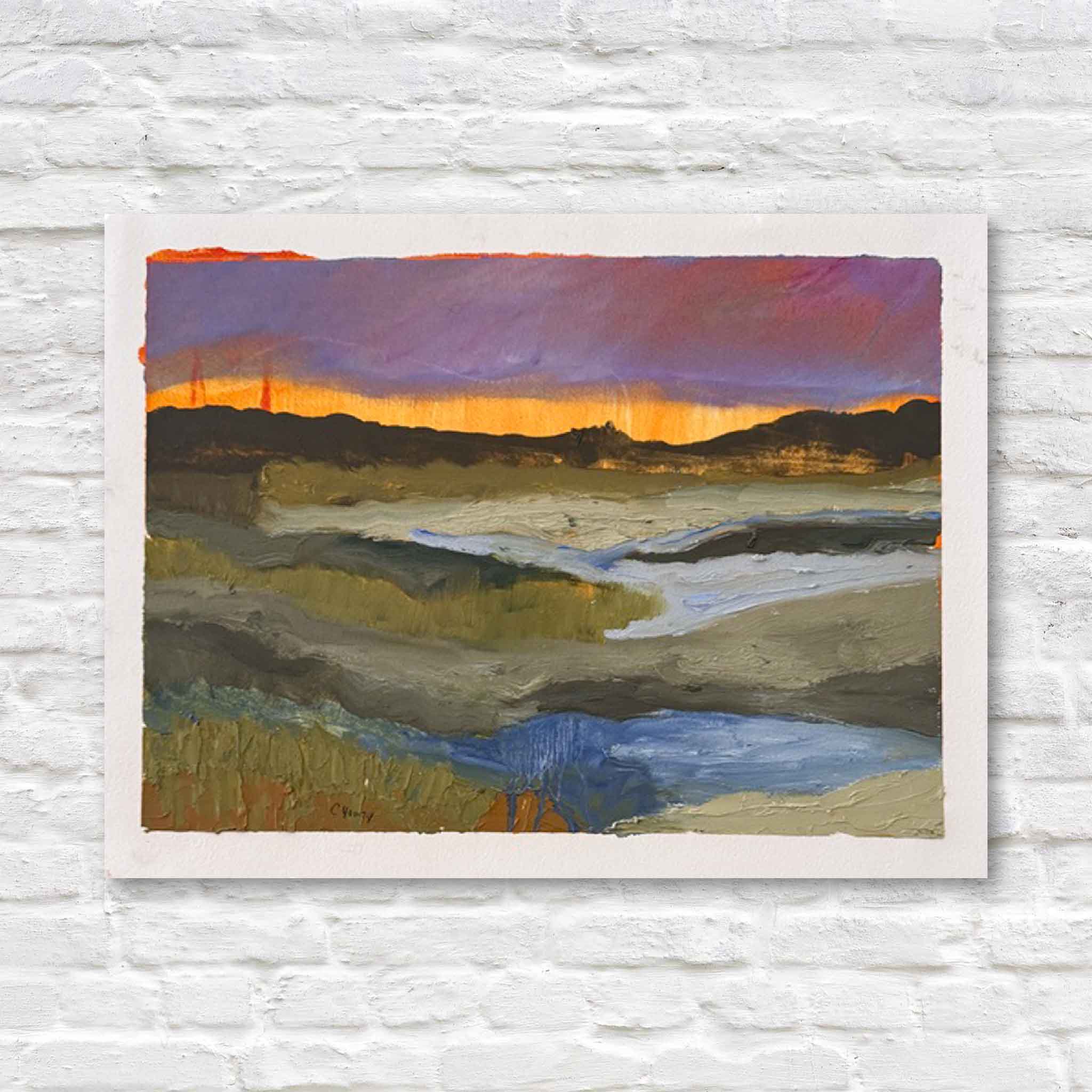 Painting of a landscape with a sunset over marsh on a white brick wall.