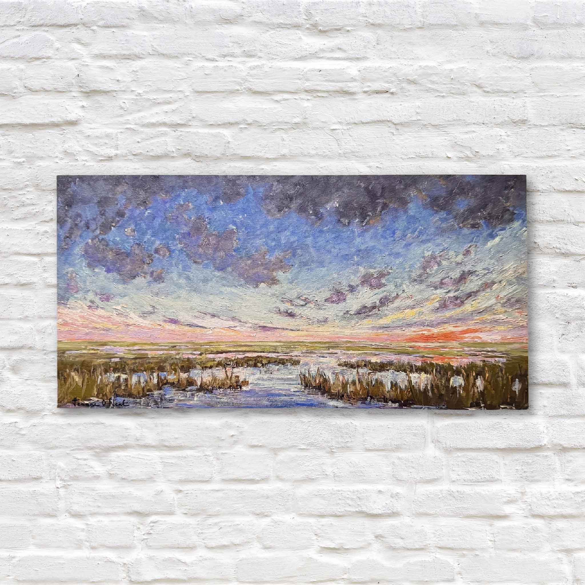 his fine art giclée print, taken from Jeanne O’Neal’s original painting, captures a sweeping sunset in full crescendo: deep blues, fiery oranges, and soft lavender reflections dancing across the lowcountry marsh below. It’s dramatic, harmonious, and full of energy.