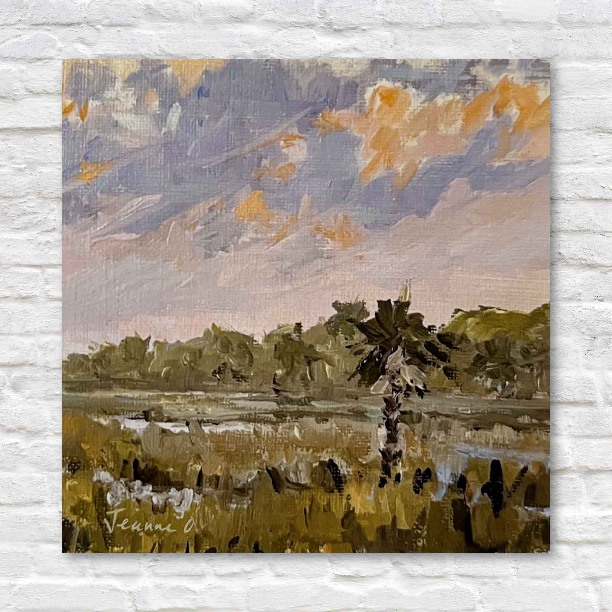 Painting of a landscape with trees and water on a textured wall.