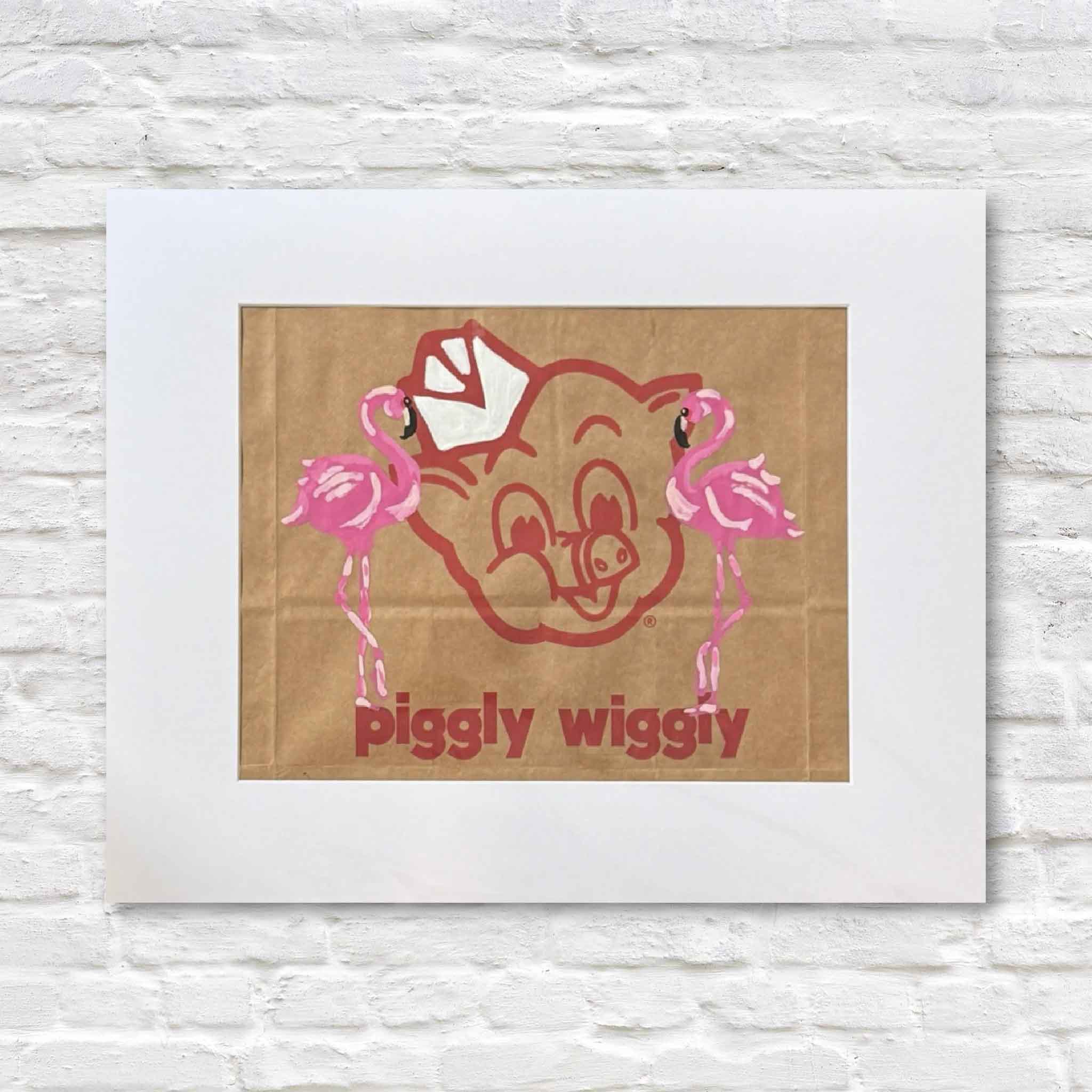 Piggly Wiggly logo with pink flamingos on a cardboard background