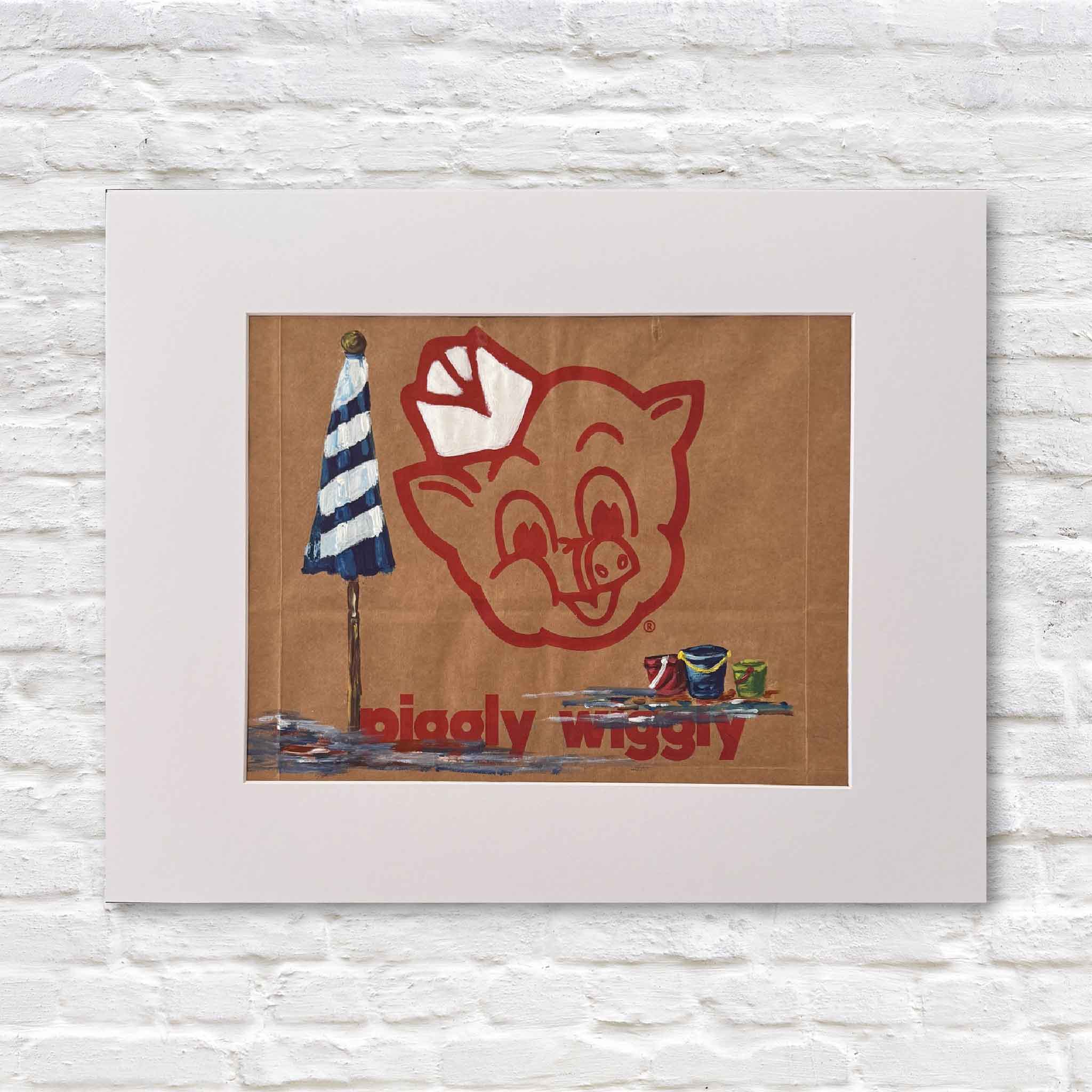 Mixed media artwork of acrylic painting of a beach scene on a Piggly Wiggly shopping bag in a white matte against a white brick wall