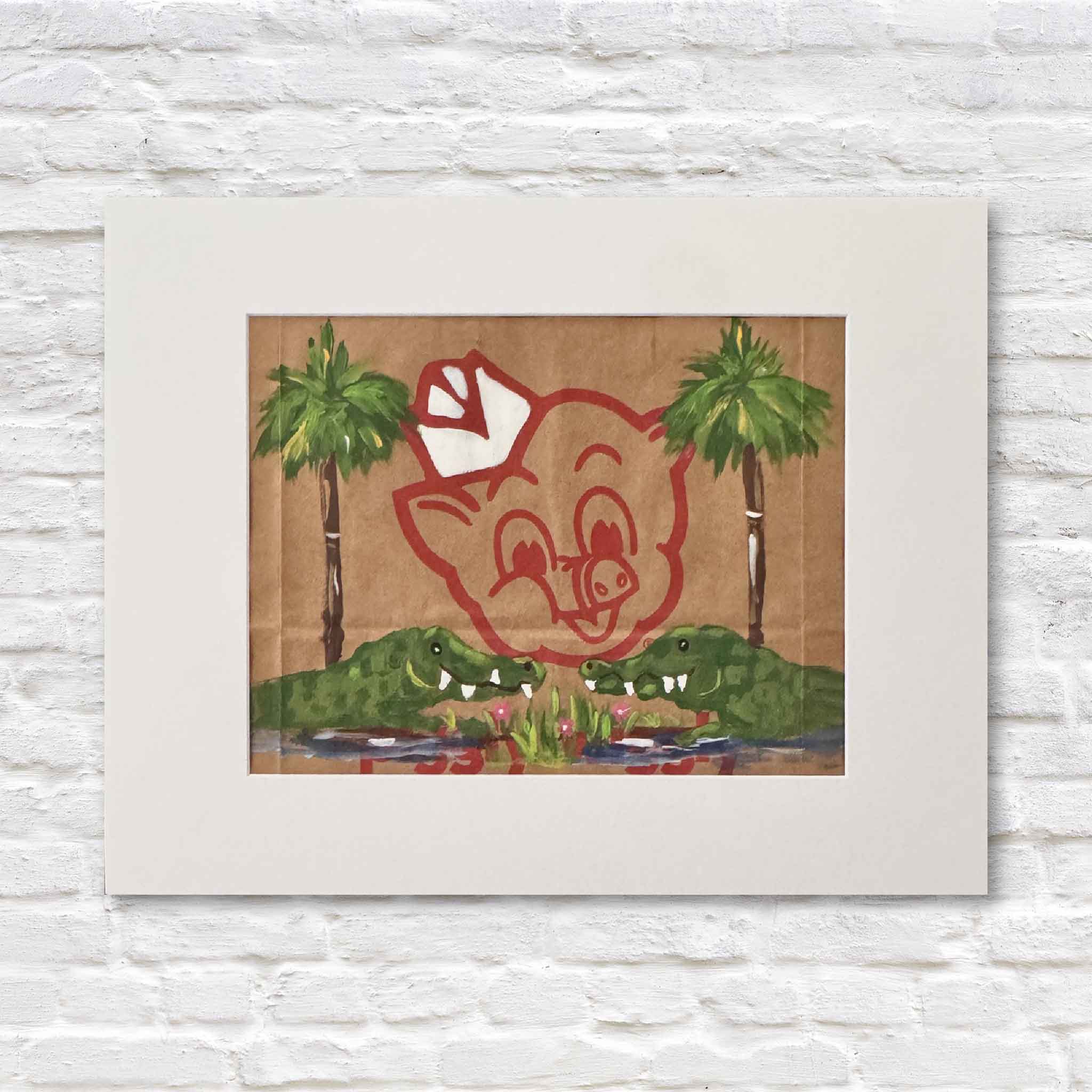 Mixed media artwork of acrylic painting of alligators and palm trees on a Piggly Wiggly shopping bag in a white matte against a white brick wall