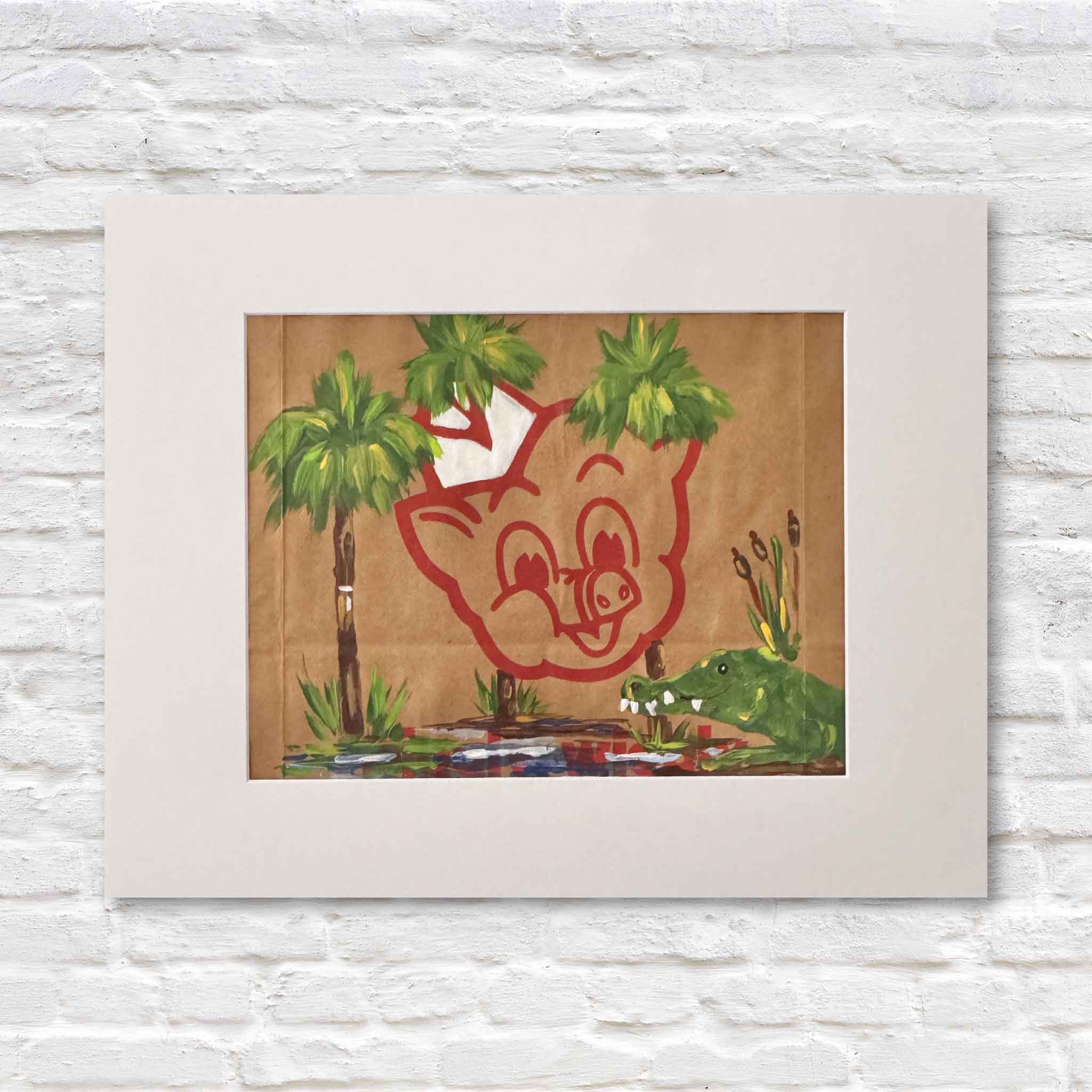 Mixed media artwork of acrylic painting of an alligator and palm trees on a Piggly Wiggly shopping bag in a white matte against a white brick wall