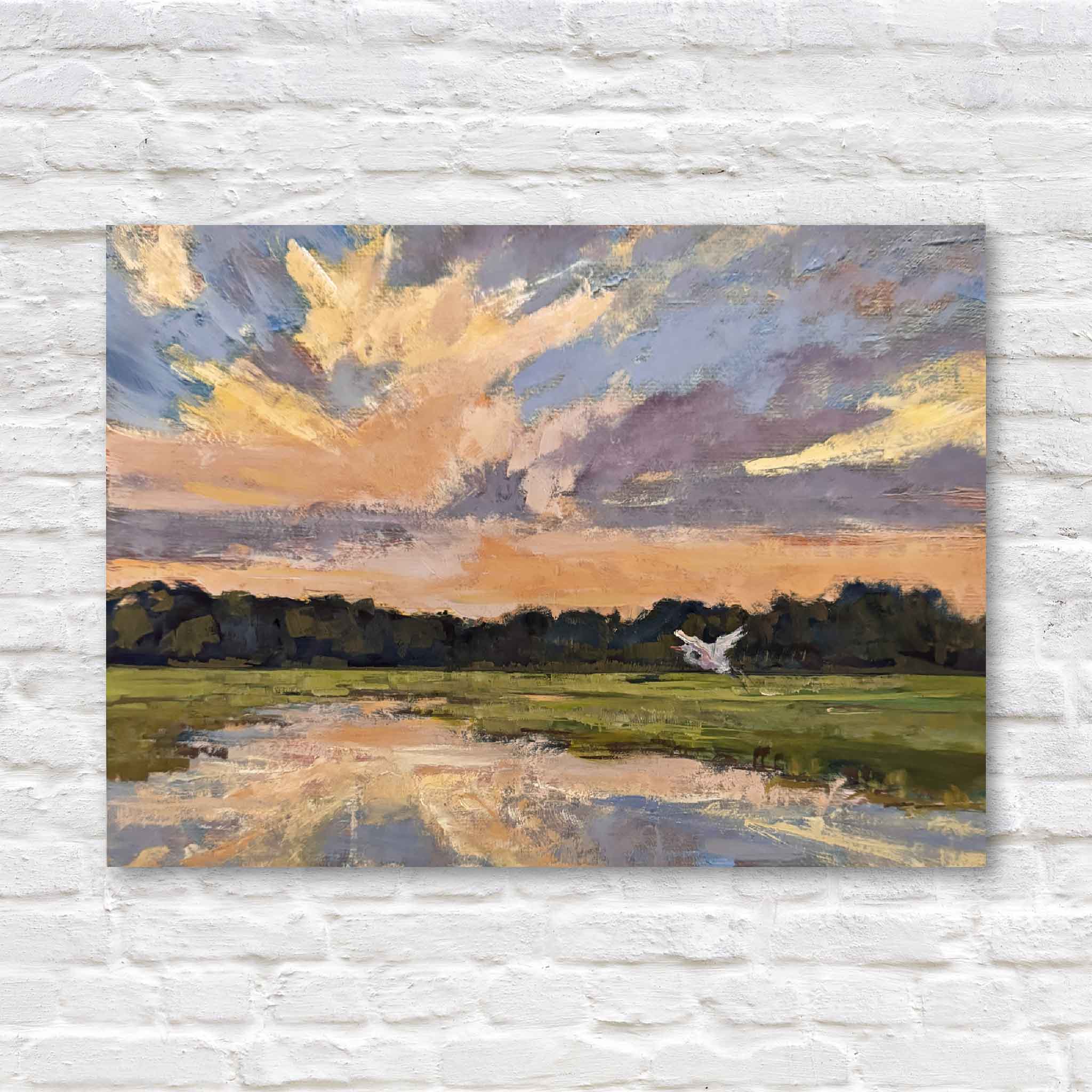 lowcountry marsh art featuring a white egret mid-flight over a glowing sunset, against a white brick wall