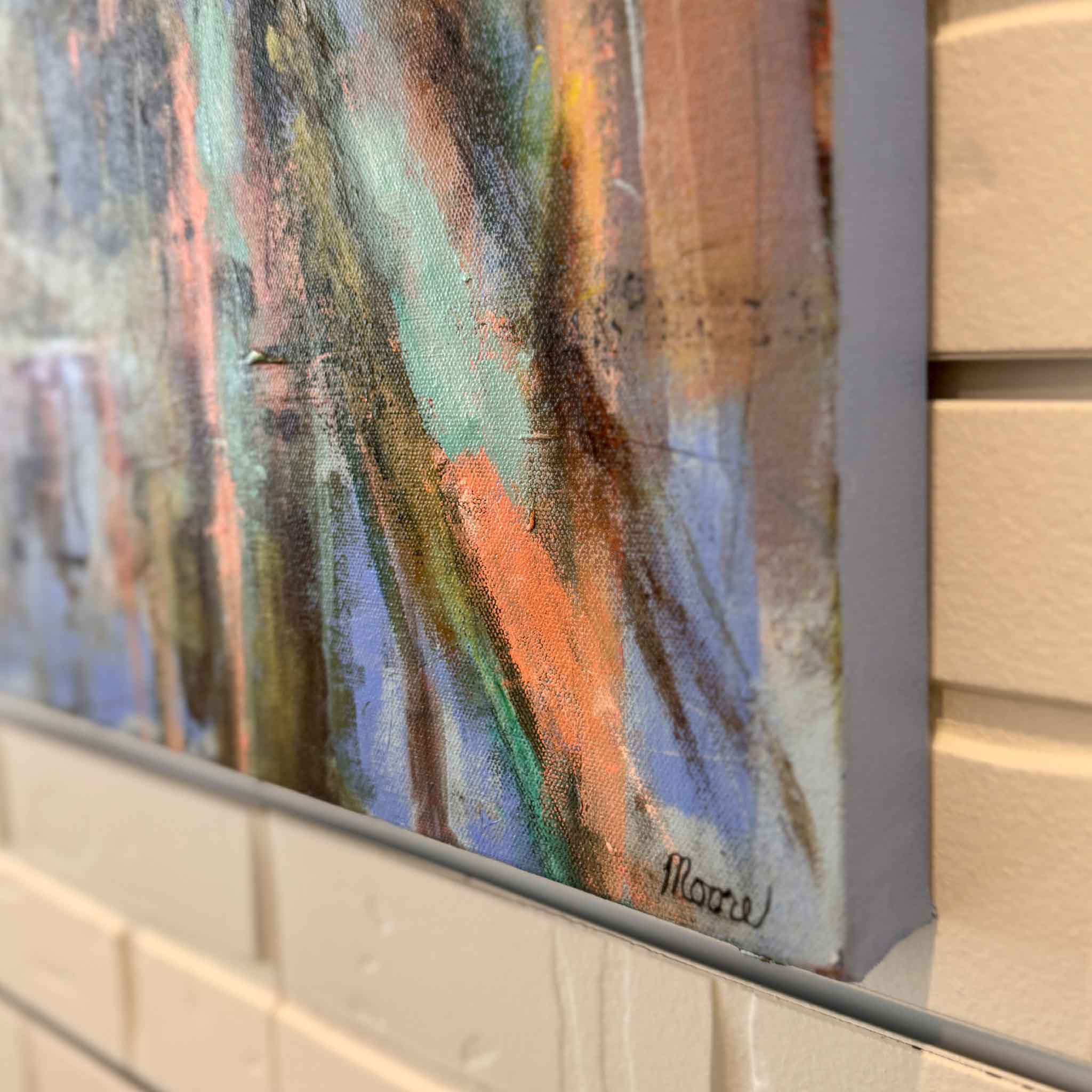 Abstract painting with visible signature on a textured wall