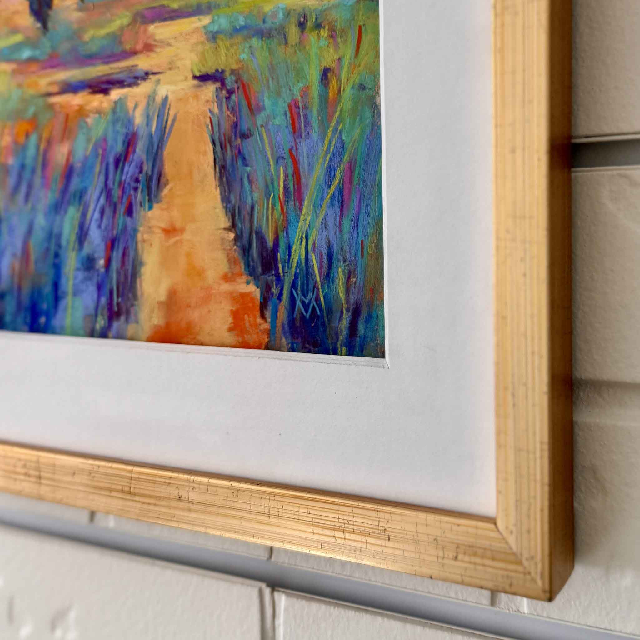 Framed abstract painting with a wooden frame on a wall.