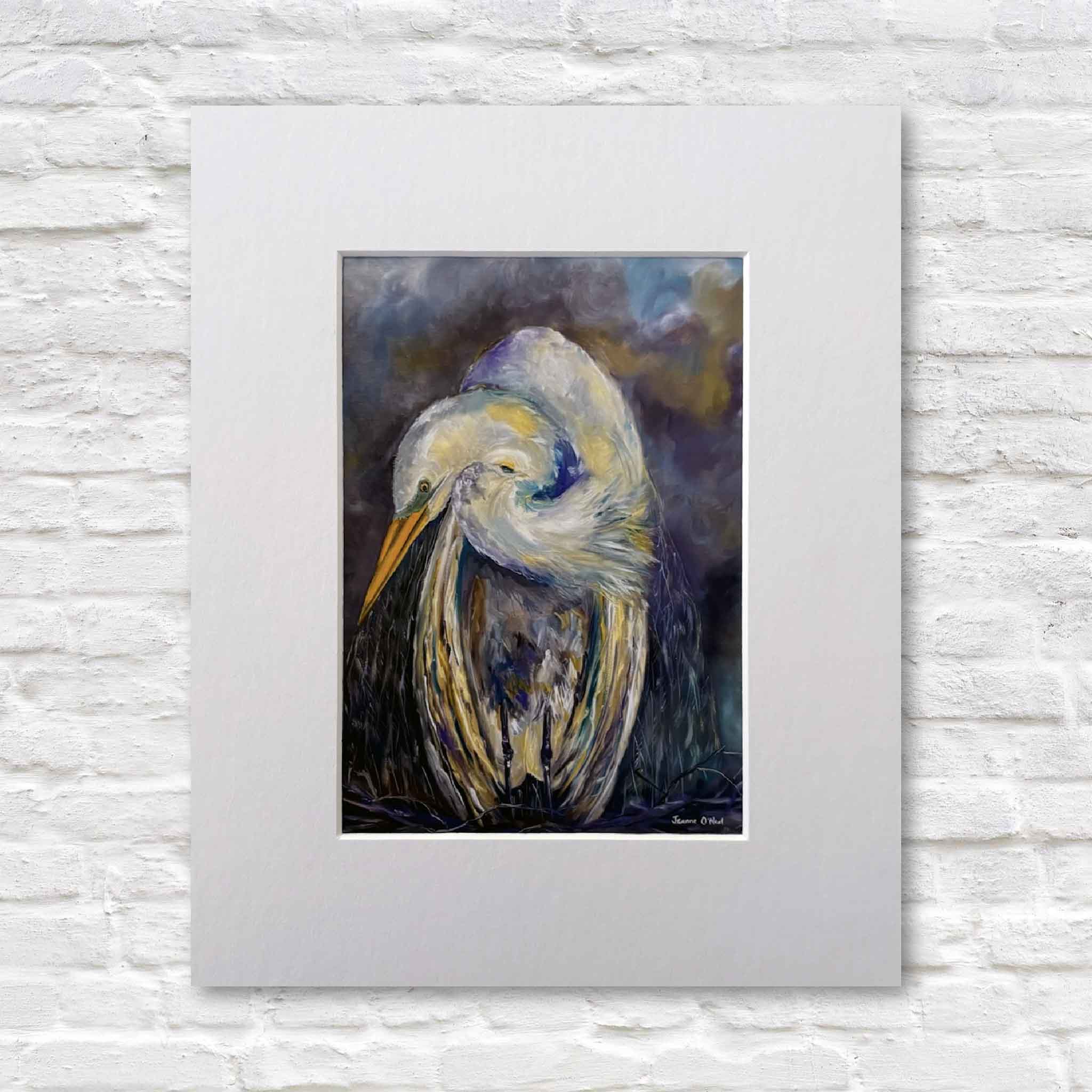 Matted giclée print of a white heron titled Strength by Jeanne O’Neal, featuring a graceful bird with layered feathers against a dark, moody background.