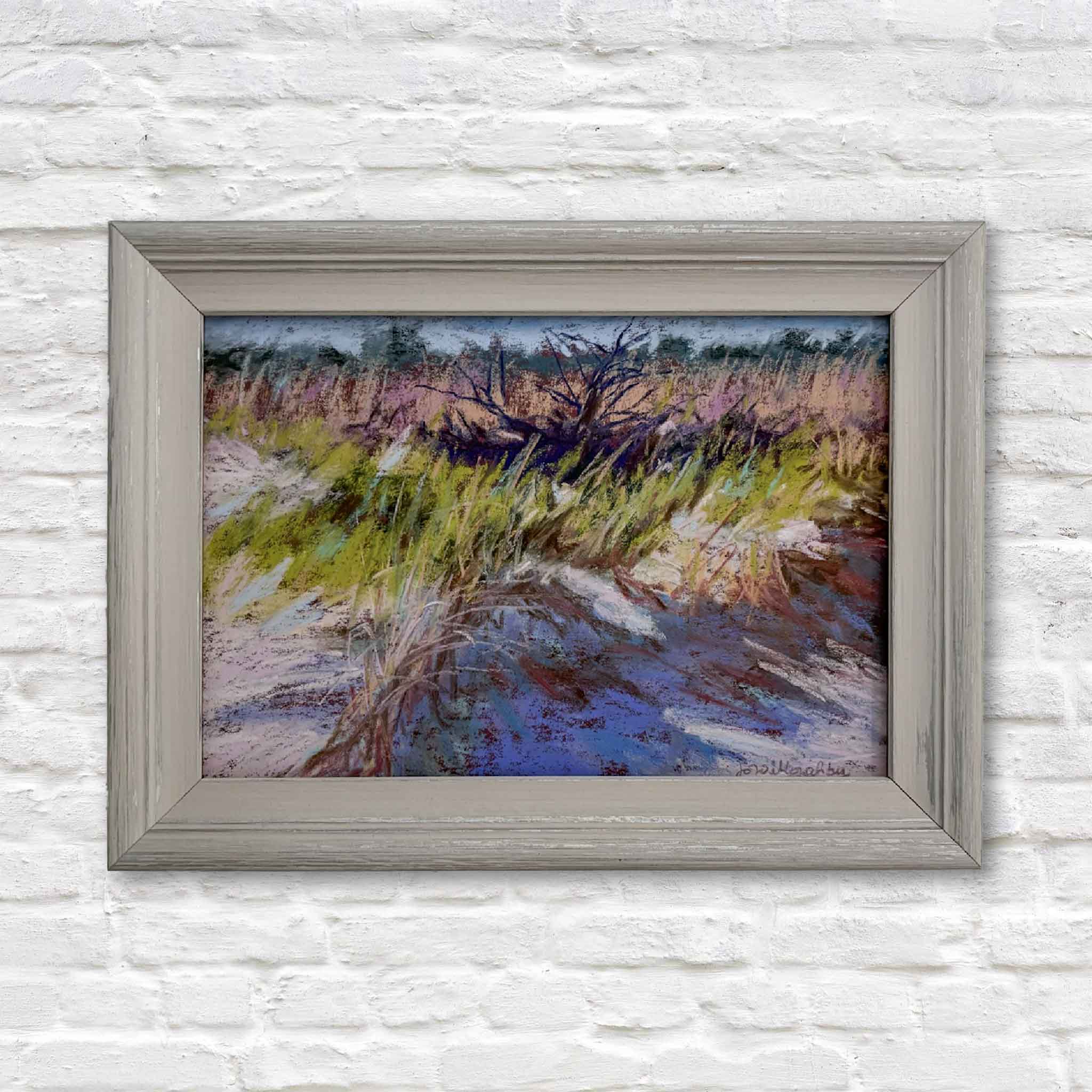 Original pastel painting A Closer Look by Joanne Willoughby featuring windswept beach grasses and dunes, framed in gray wood.
