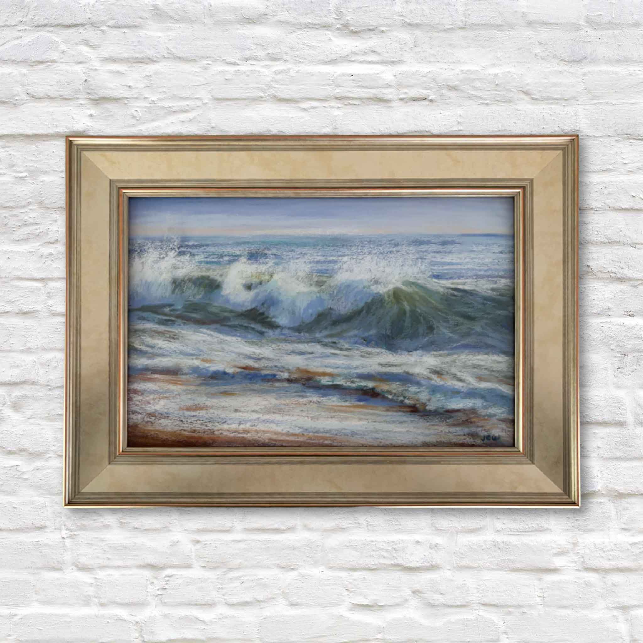 Original pastel painting of ocean waves crashing on the shore, framed in a champagne-toned frame — “Happy Dance” by Joanne Willoughby.