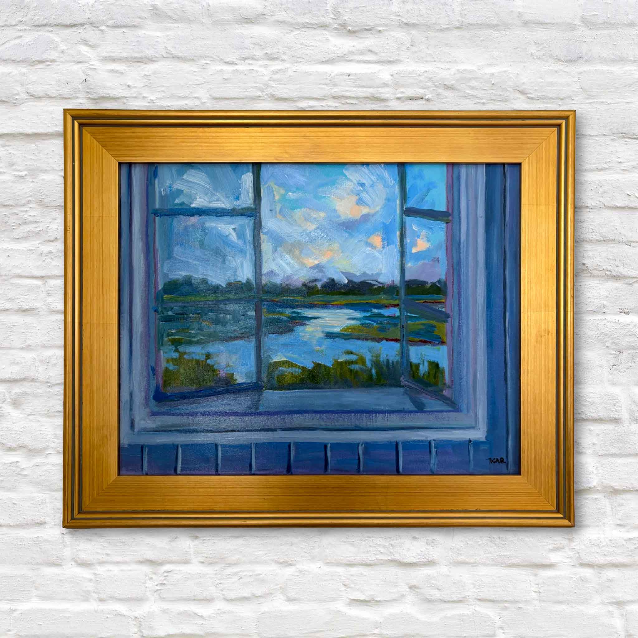 "View from Window" oil painting by Kathy Robinson in gold frame, featuring serene Lowcountry marsh scene viewed through an open window.
