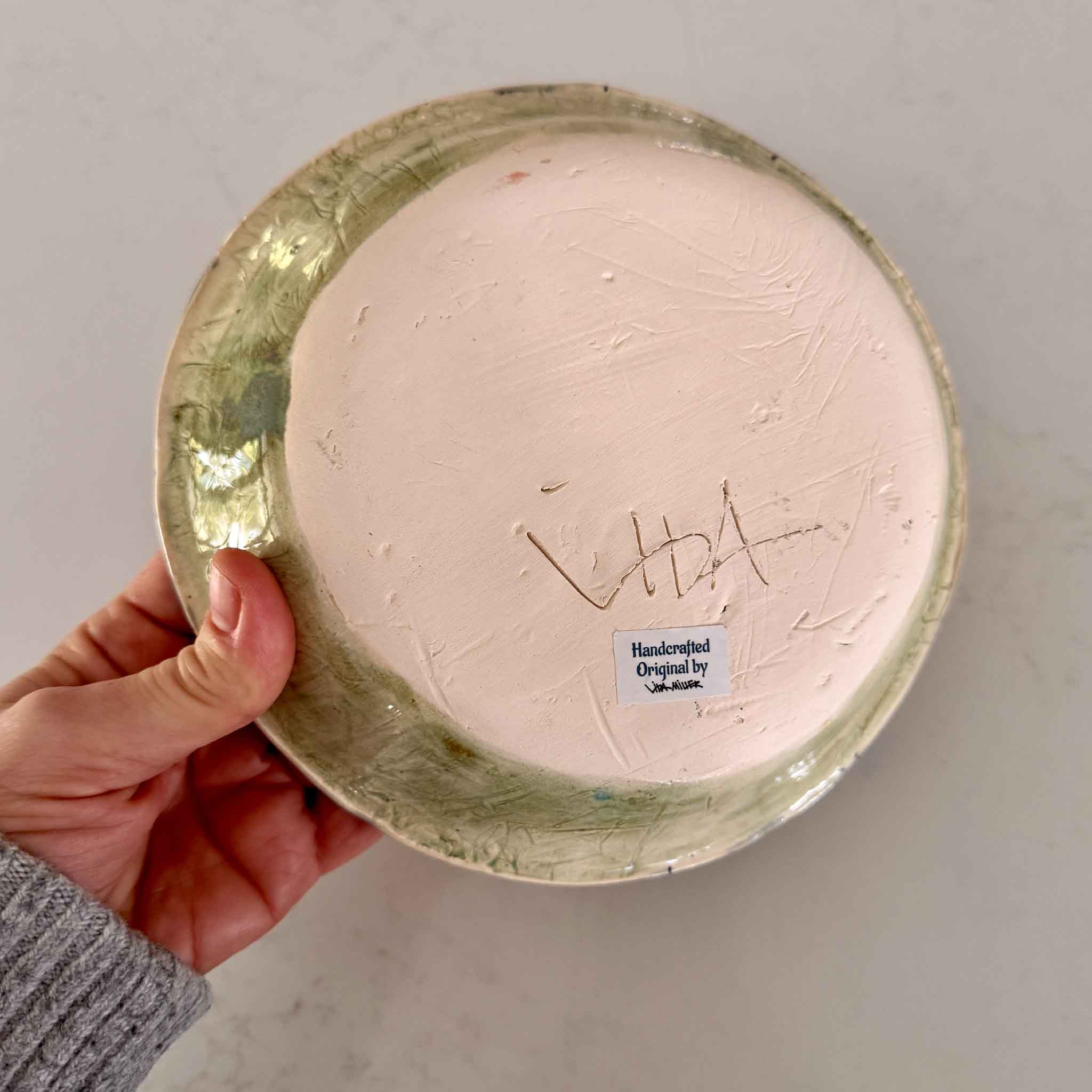 hand made ceramic plate with a textured design on made by local potter in Pawleys Island