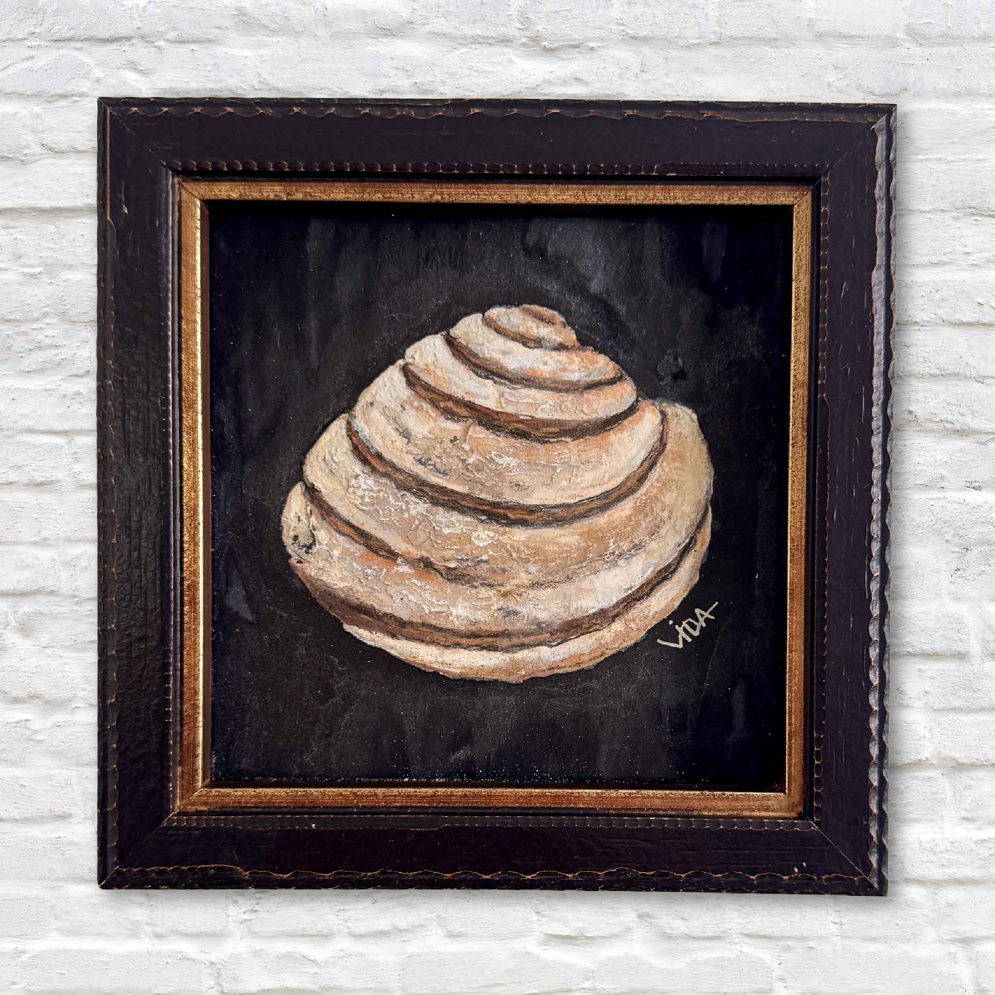 “The Shell” pastel painting by Vida Miller, featuring a Pawleys Island shell on a dark background, framed in black and gold — Lowcountry coastal art.