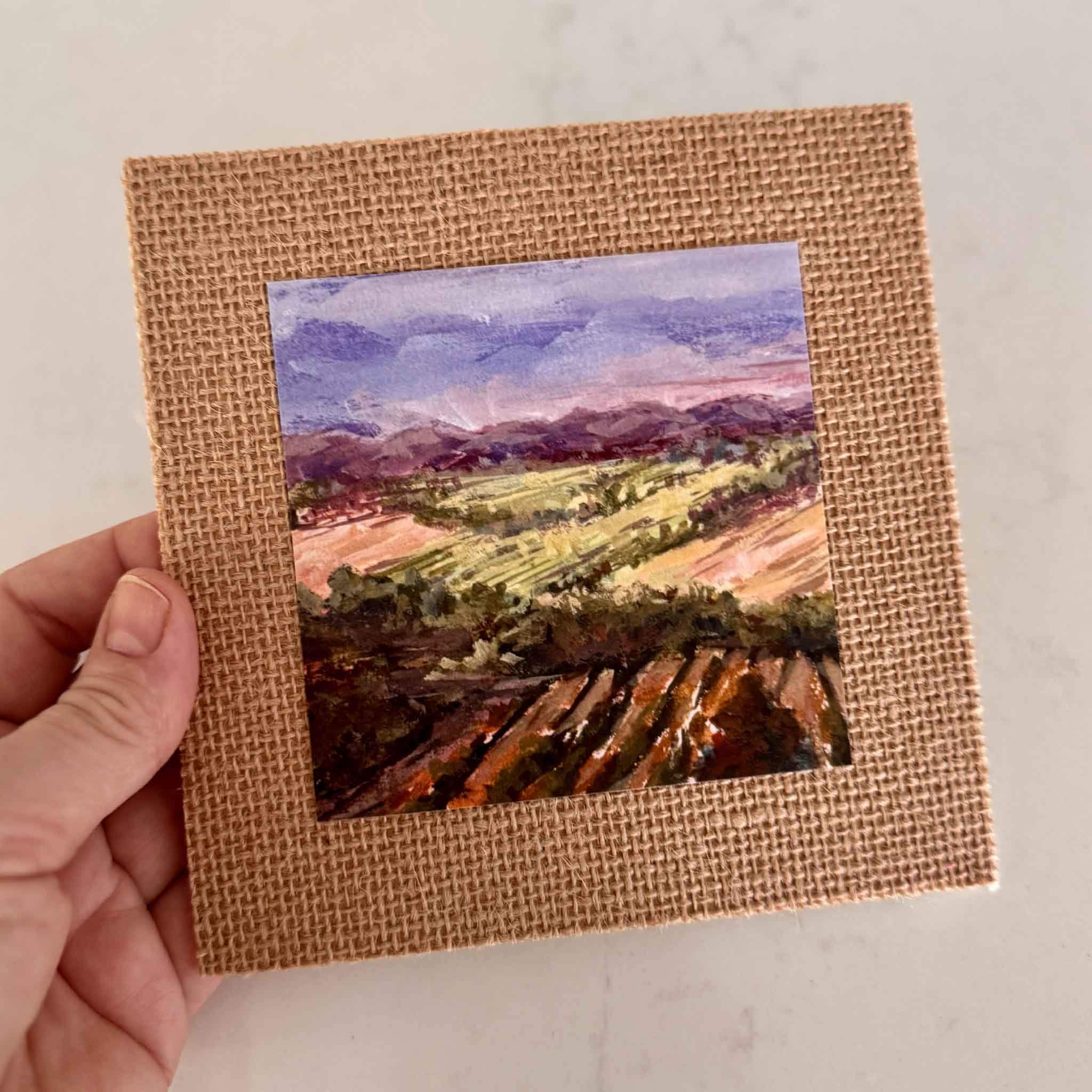 Fields of France giclée print by Jeanne O’Neal, 4x4 artwork on 6x6 burlap mat, fine art landscape of French countryside, available at Gray Man Gallery