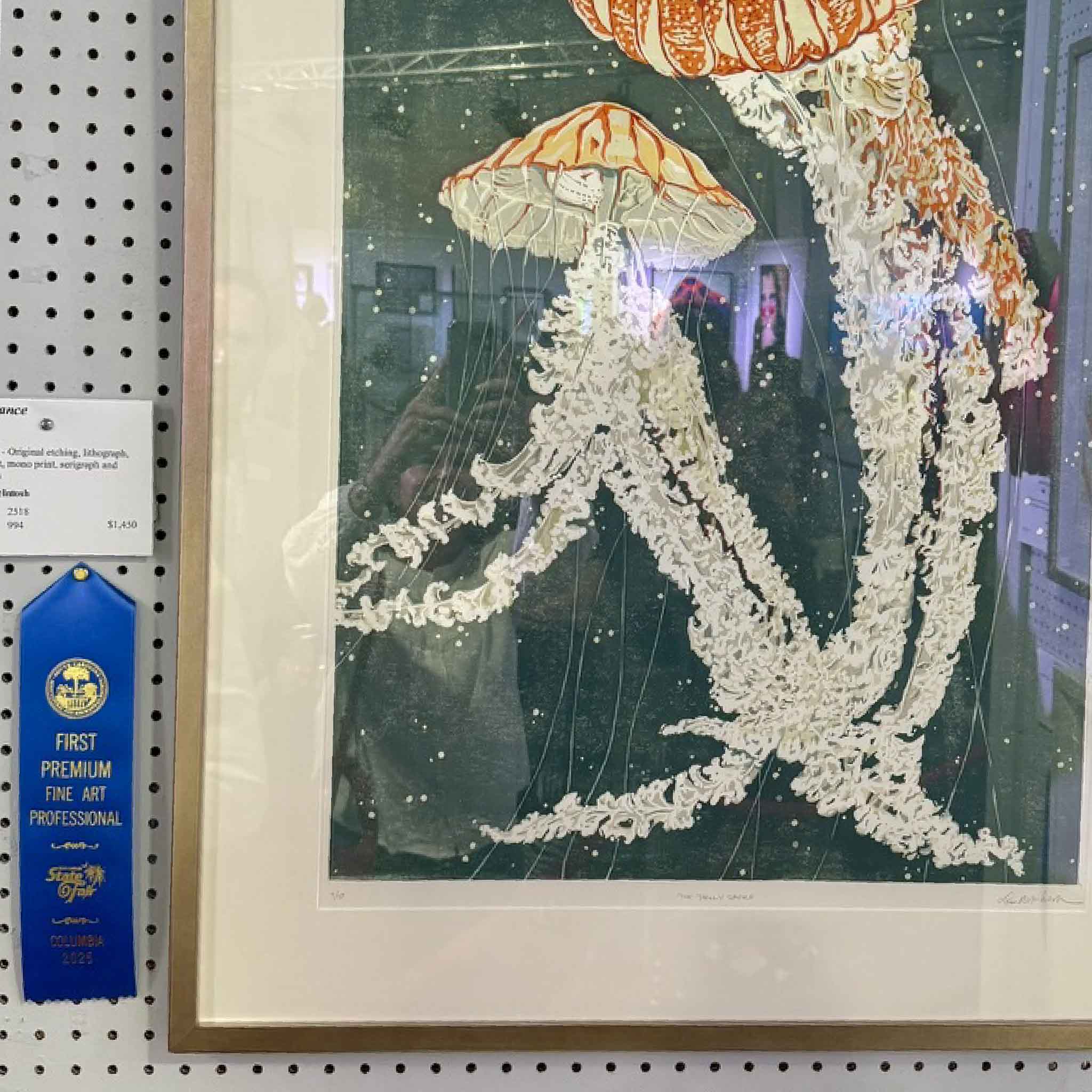 Laurie McIntosh blue ribbon linocut print Jelly Dance, jellyfish in coral and ivory tones on indigo background, archival fine art marine print