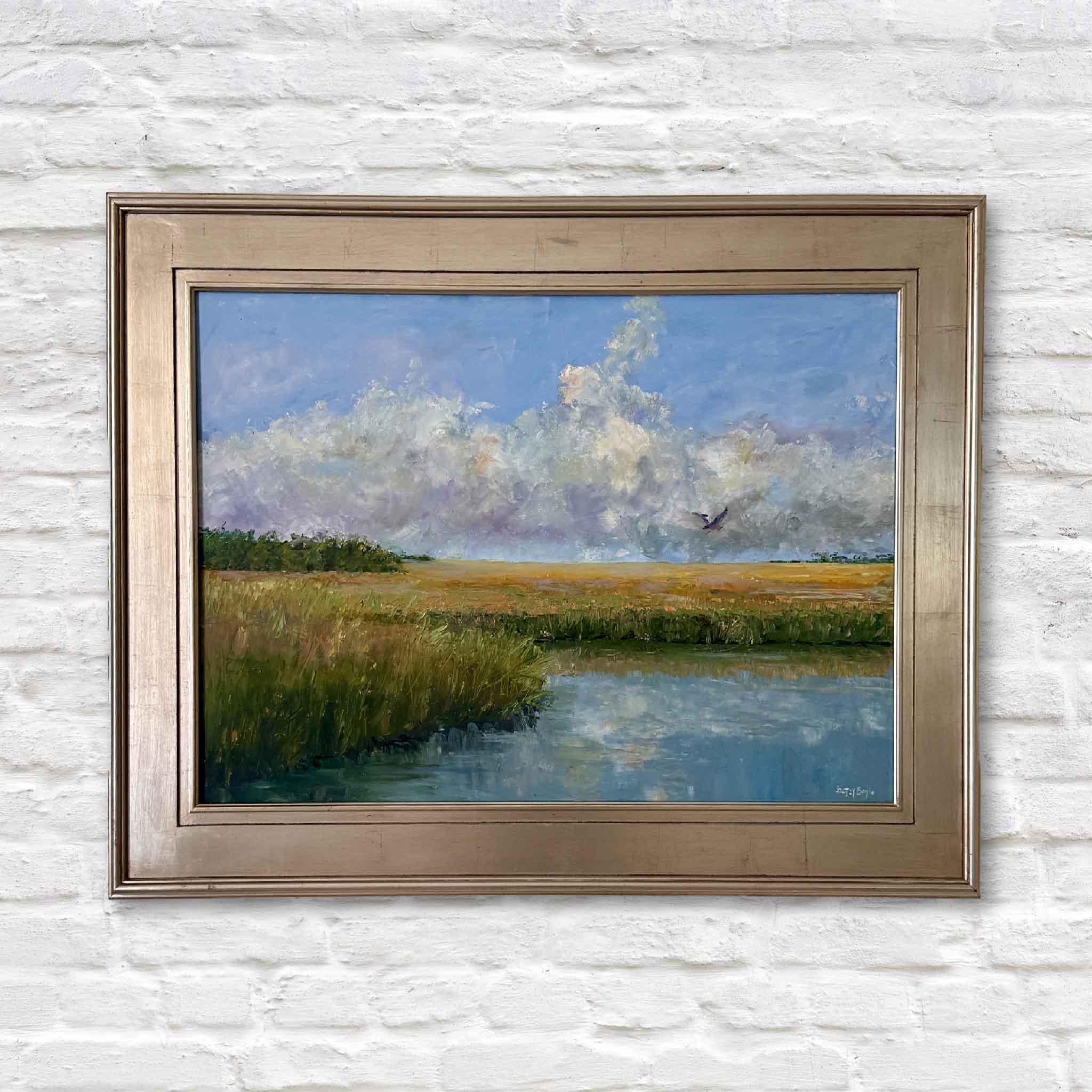 Golden oil painting by Betsy Boyle, framed South Carolina marsh landscape with golden grasses, blue sky, and flying bird, Lowcountry coastal artwork exclusive to Gray Man Gallery