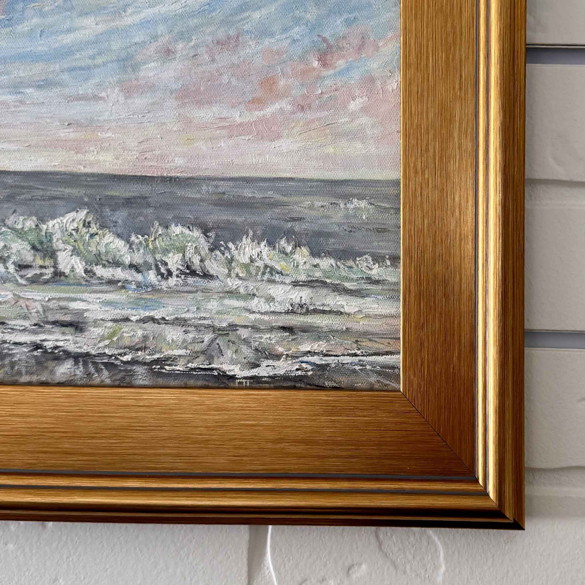 Coastal Calm original oil painting by Jeanne O’Neal depicting gentle ocean waves and pastel sunrise sky, framed coastal landscape art from Gray Man Gallery, Pawleys Island SC