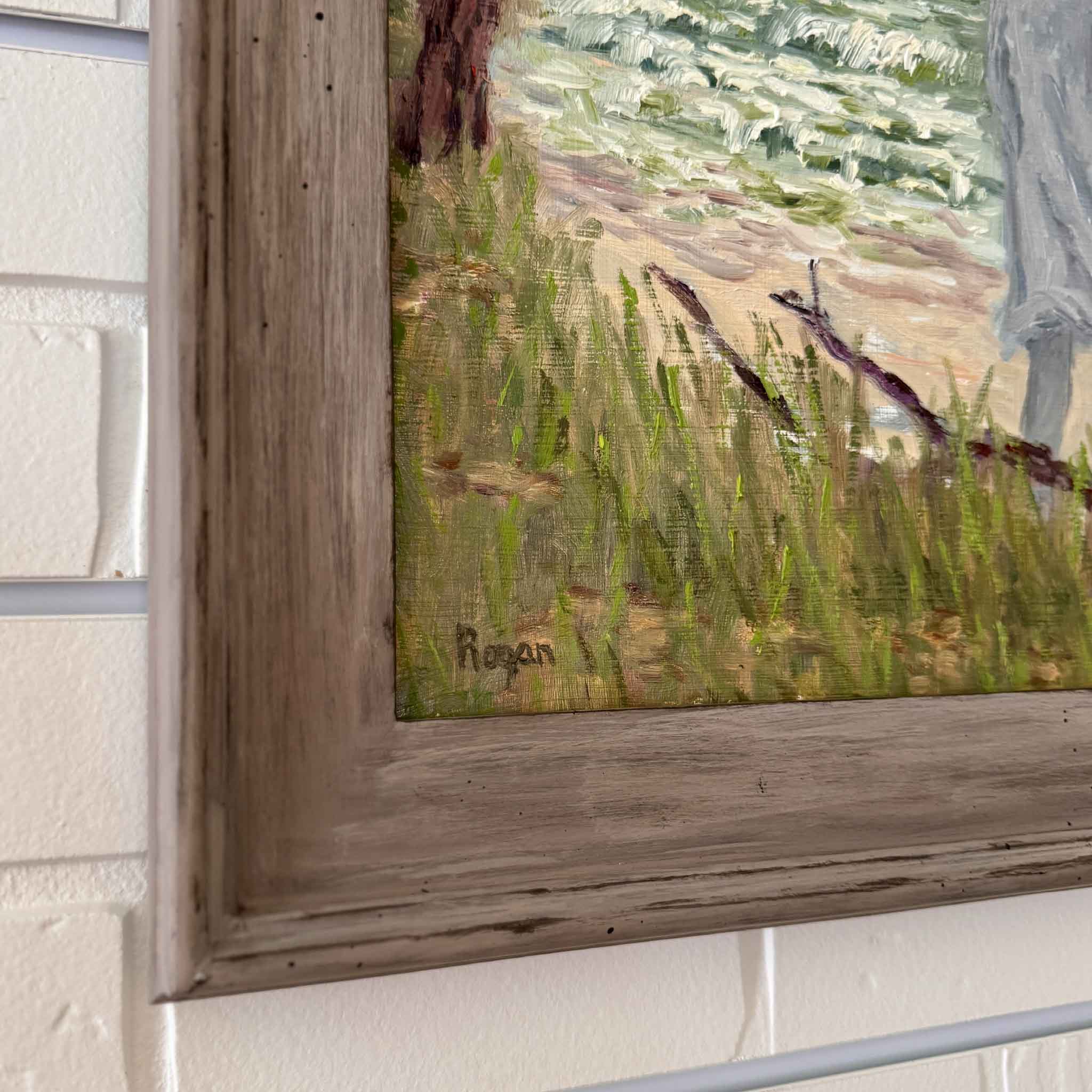 Original oil painting The Gray Man by Michael Rogan, depicting the legendary ghostly figure on the shore of Pawleys Island, framed in rustic weathered wood.
