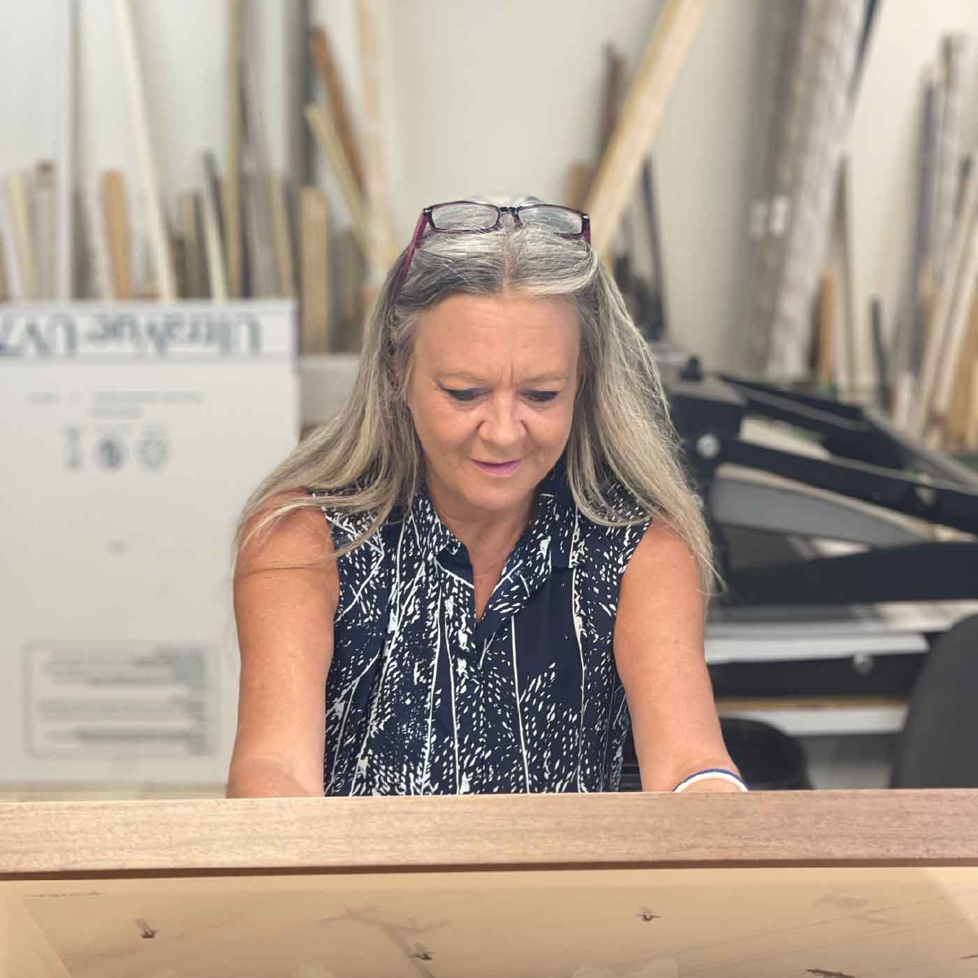 Charlotte hard at work in the frame shop
