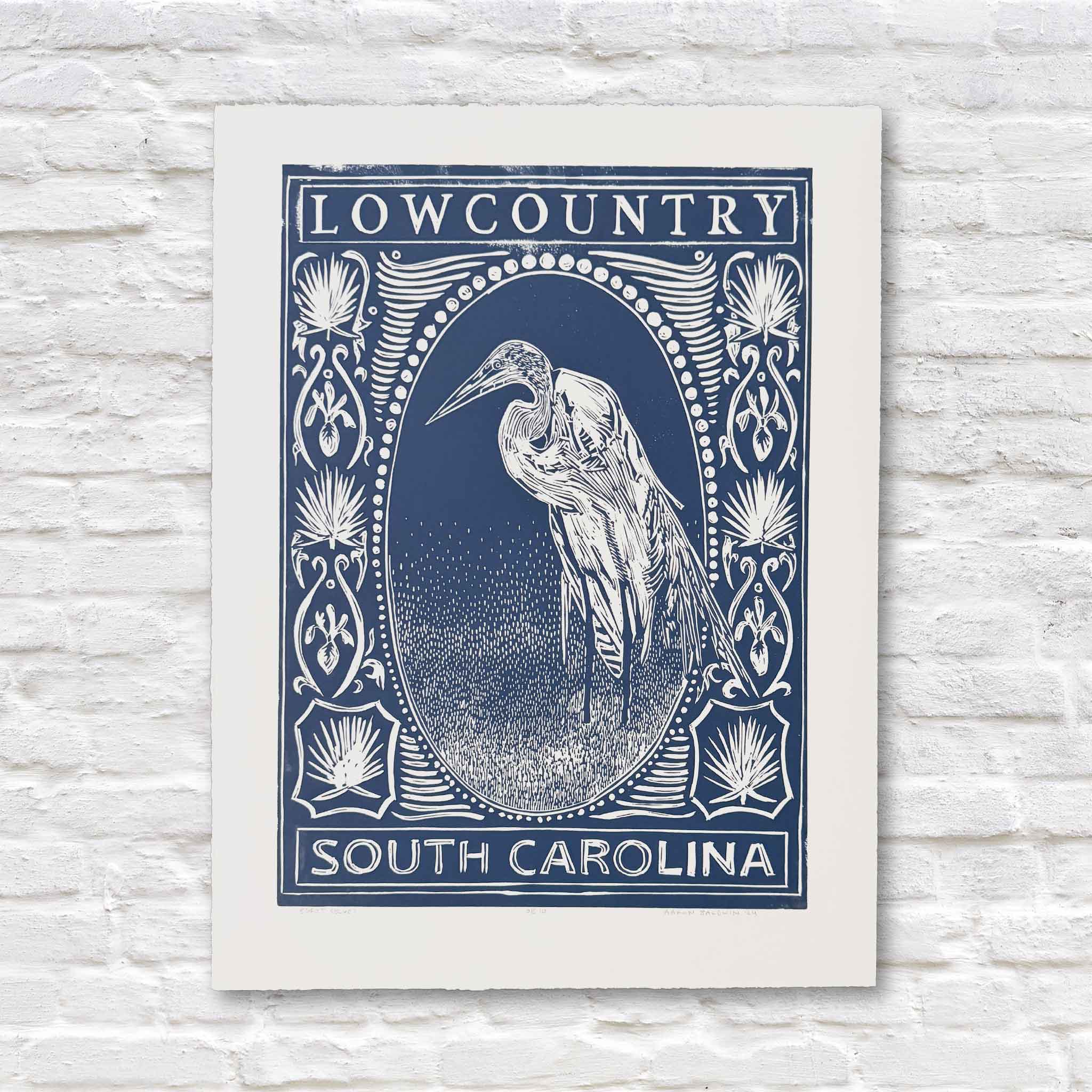 Egret linocut print by Aaron Baldwin in blue ink, with heron illustration and Lowcountry detailing.