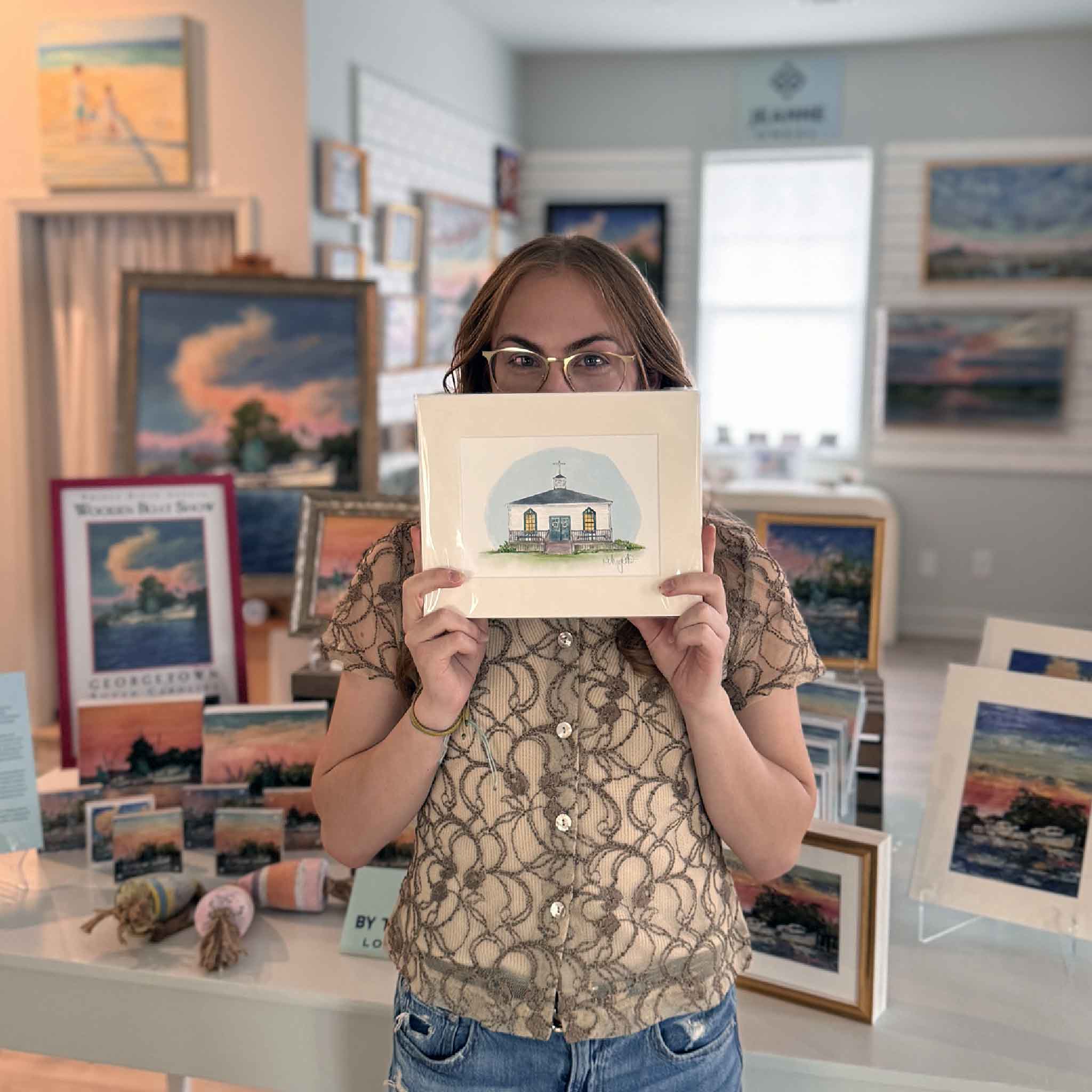 The Chapel fine art print by Paper Muffin featuring a white seaside chapel with yellow windows, printed on archival paper and matted to 8x10, signed by the artist. Available exclusively at Gray Man Gallery.