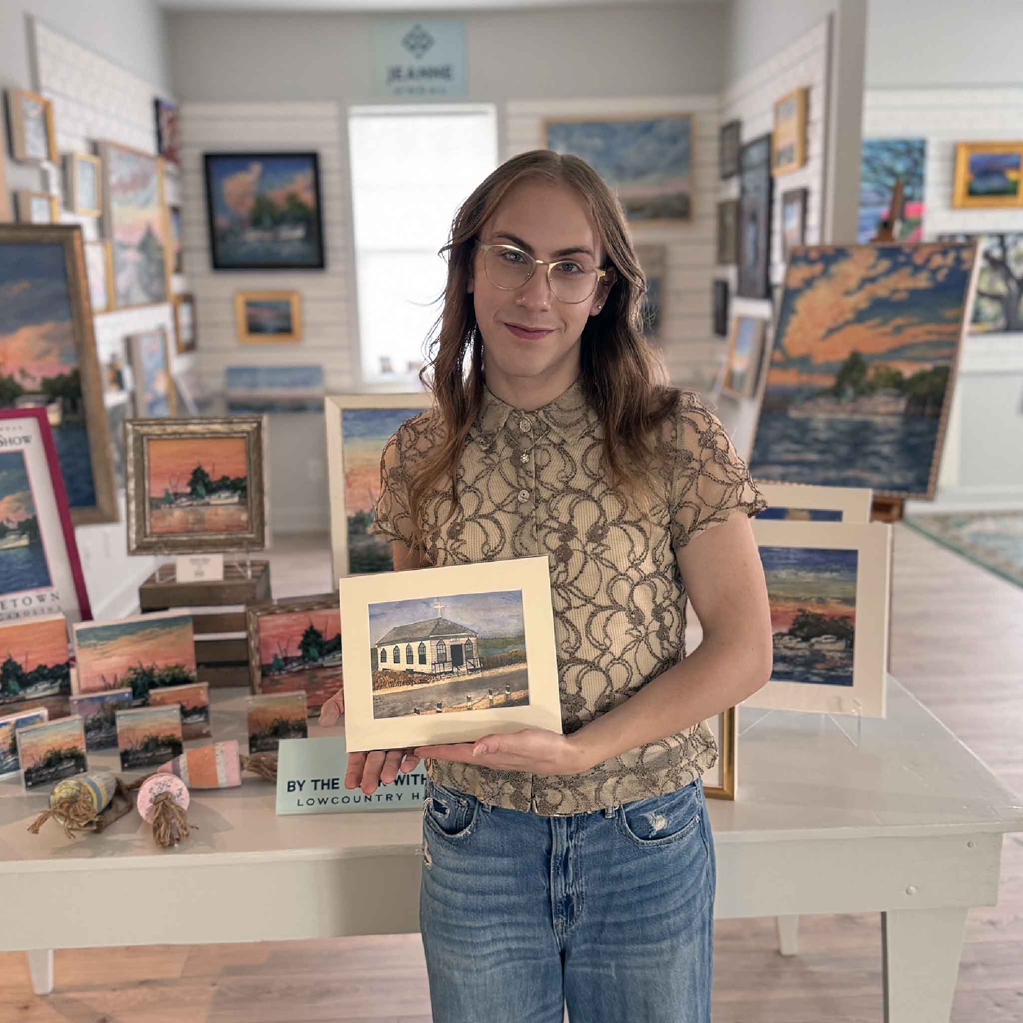 8×10 matted print of The Old Chapel by Tootsie Watkins featuring the historic Pawleys Island chapel with folk-art coastal scenery. Pictured at Gray Man Gallery.