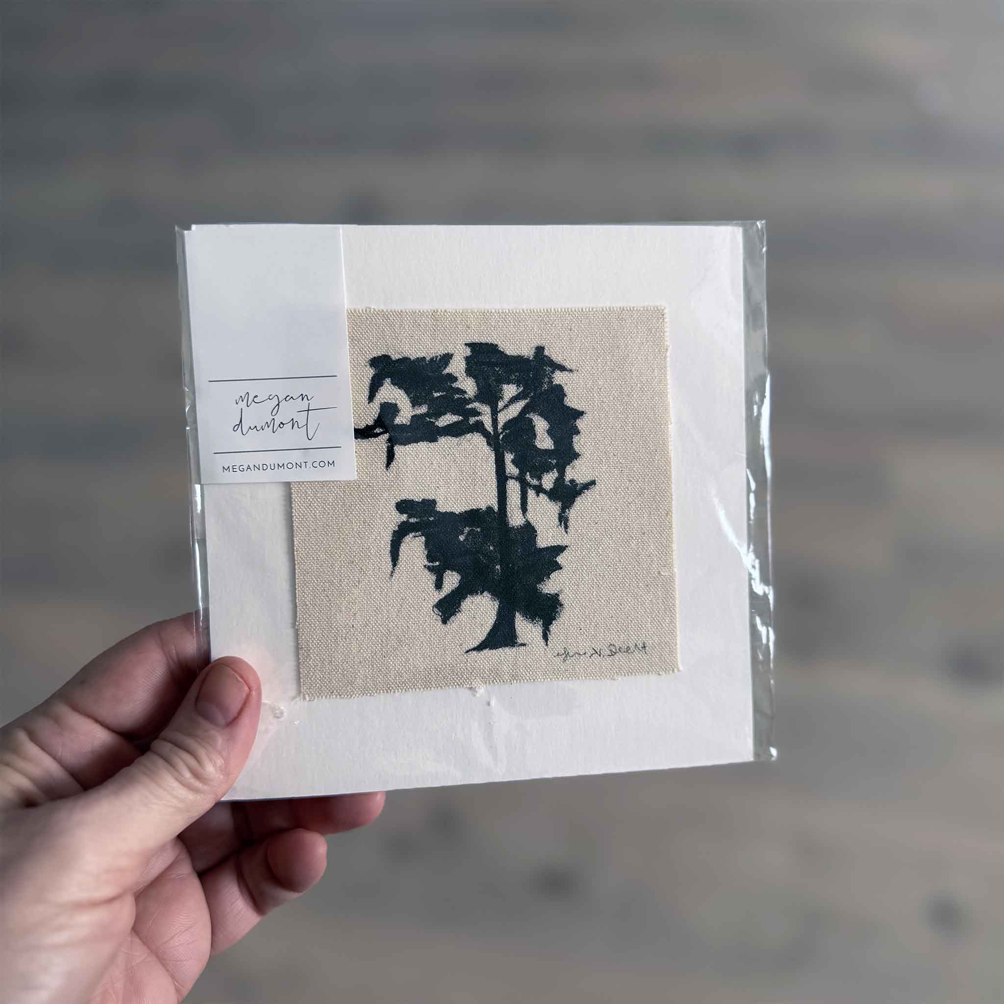 Original canvas painting by Megan Dumont featuring a dark abstract tree silhouette, matted and packaged for display.