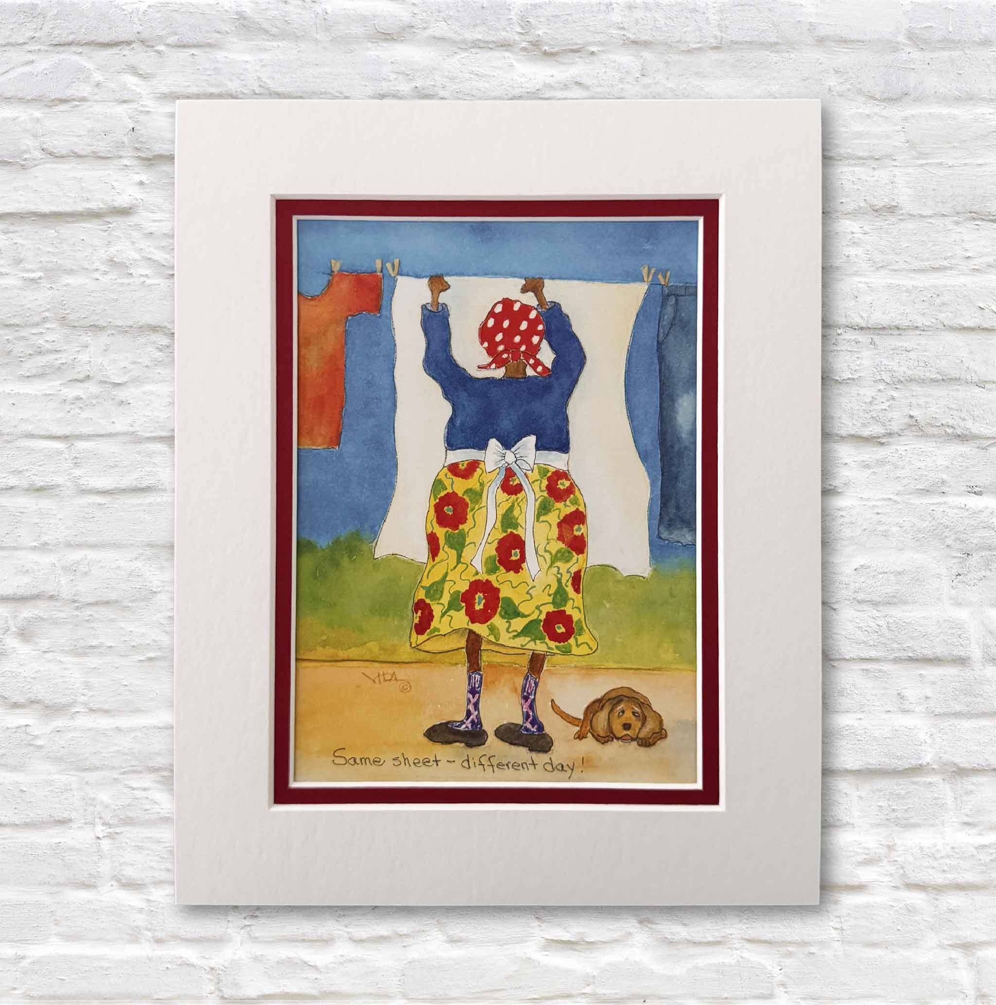 Matted 8x10 Vida Miller print titled “Same Sheet, Different Day,” featuring a colorful Little Lady hanging laundry with a dog resting at her feet.