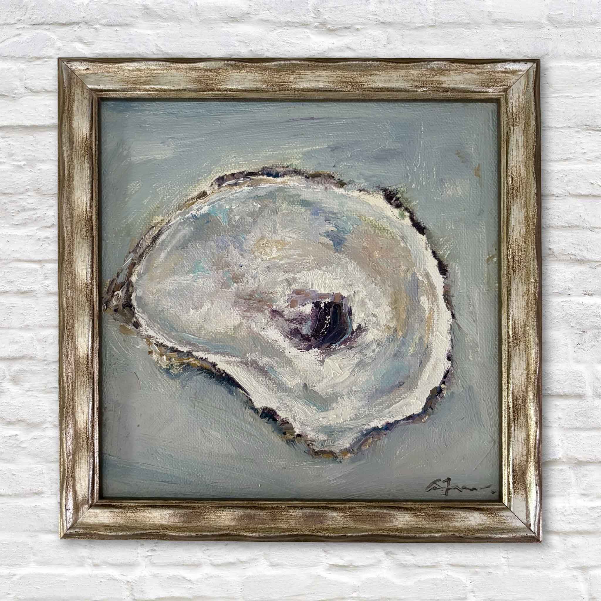 Reflection, an original oyster shell oil painting by local South Carolina artist Allison Farr, featuring soft pearl, blue-gray, and lavender tones inspired by the Lowcountry coast. Professionally framed and photographed at Gray Man Gallery in Pawleys Island, South Carolina.