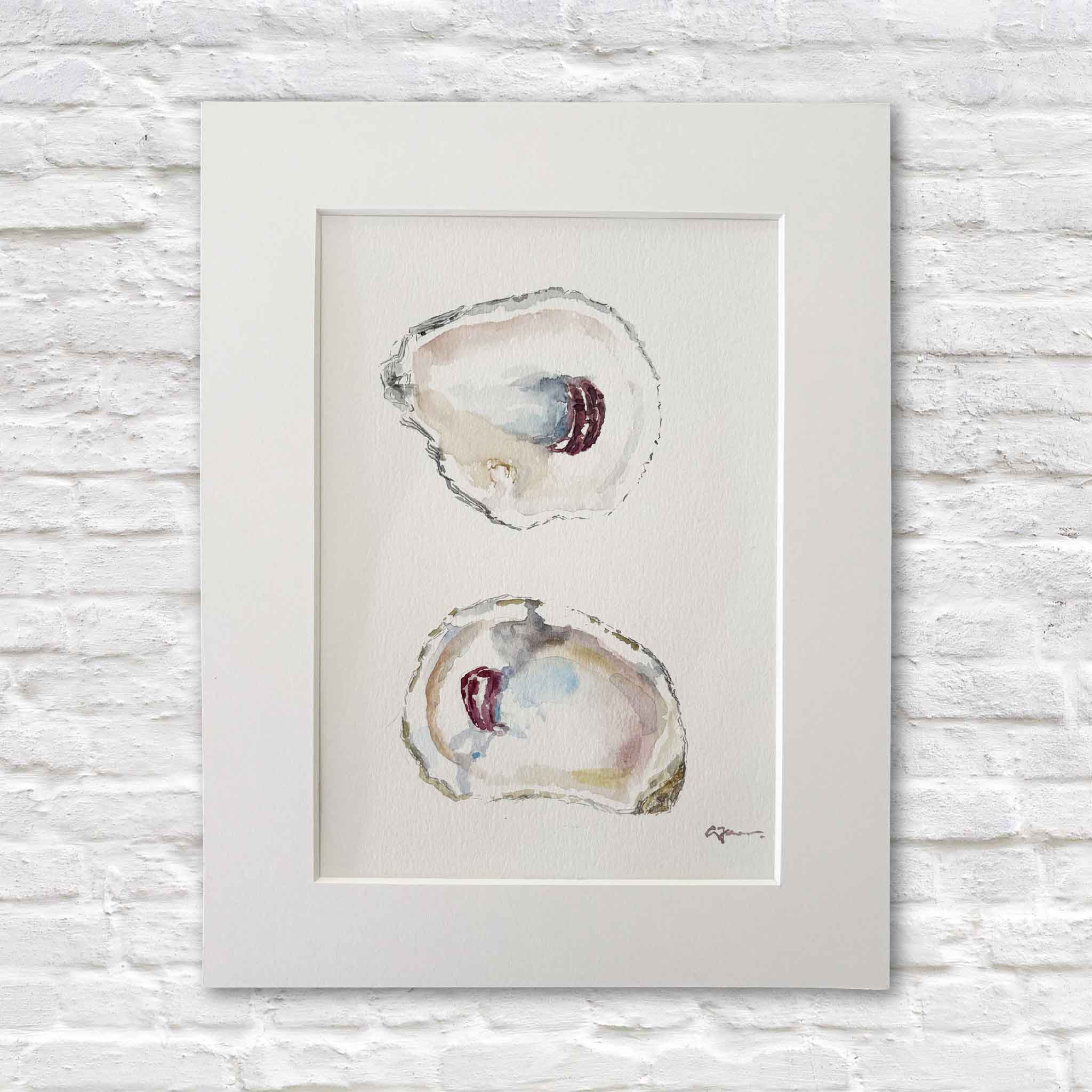 Original watercolor titled "Surprise" by Lowcountry artist Allison Farr featuring two luminous oyster shells painted in delicate coastal blues, pearly whites, soft blush tones, and warm neutrals. Professionally matted to fit a standard 9x12 frame and available at Gray Man Gallery in Pawleys Island, South Carolina.
