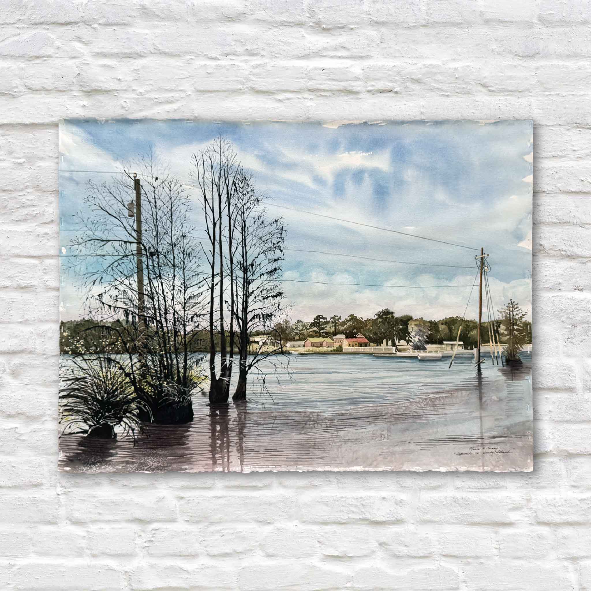 Approach to Sandy Island, an original watercolor by local artist Maura Kenny, depicting a quiet boat approach to Sandy Island near Pawleys Island with reflective water, shoreline trees, and soft coastal light, available at Gray Man Gallery in Pawleys Island, South Carolina