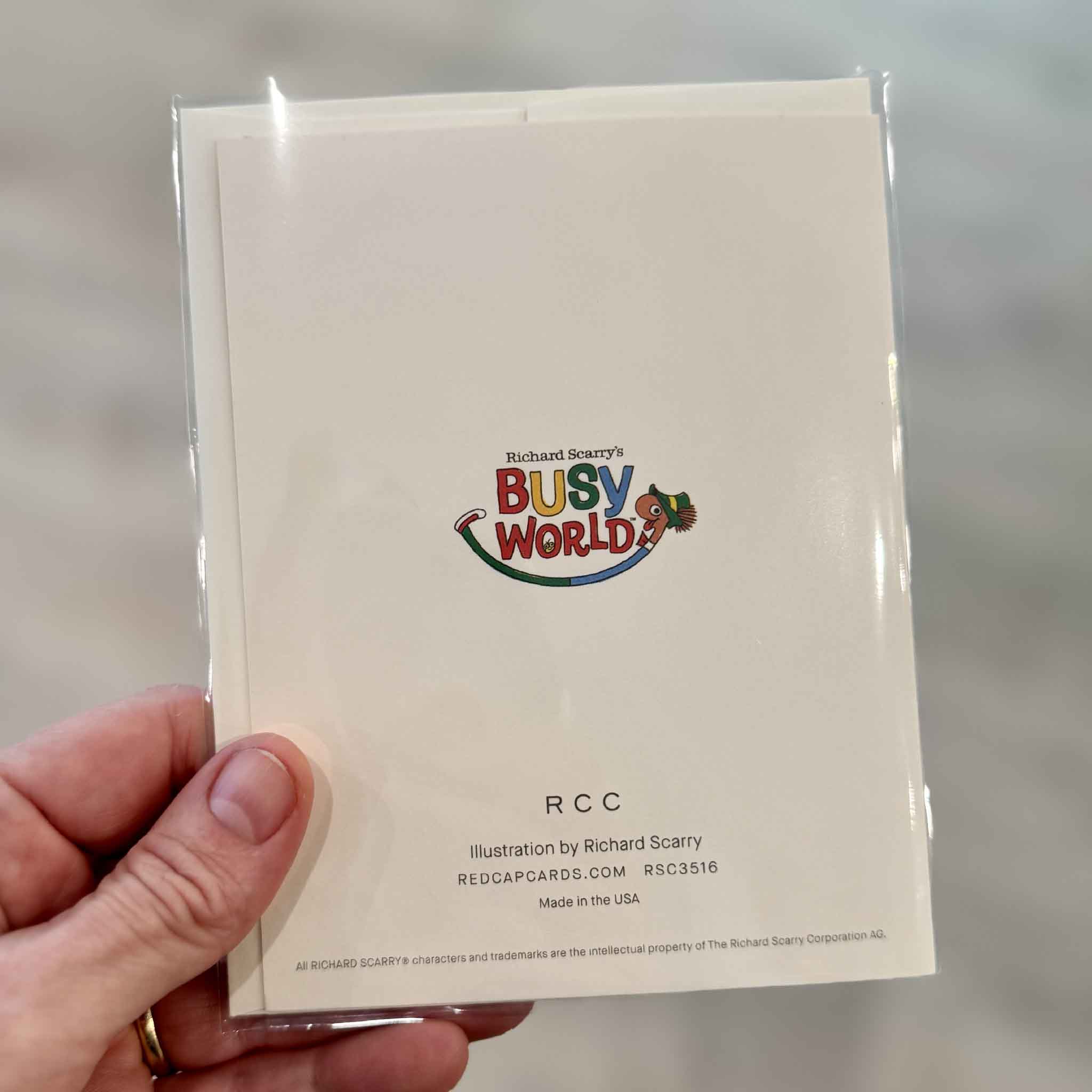 Back of the officially licensed Richard Scarry Best Mate greeting card by Red Cap Cards featuring the colorful Busytown logo and artist information. Available at Gray Man Gallery in Pawleys Island, South Carolina.