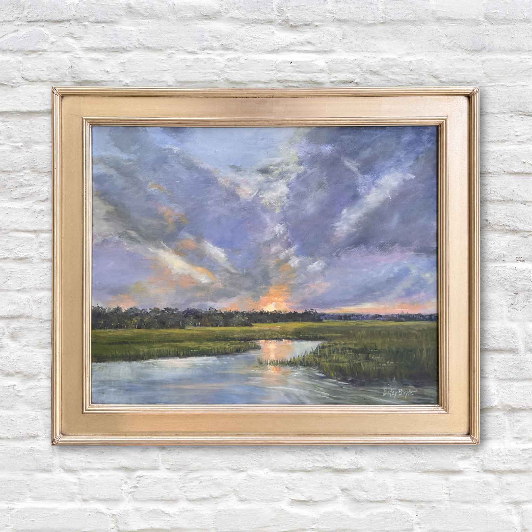 Dramatic Exit by Betsy Boyle original oil painting featuring a Lowcountry marsh landscape at sunset with expansive dramatic clouds, soft blue and violet tones, and warm golden light reflecting across winding water, presented in a classic gold frame at Gray Man Gallery in Pawleys Island, South Carolina