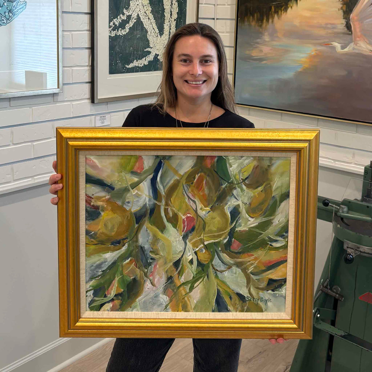 Fruitful in Gold original botanical oil painting by South Carolina artist Betsy Boyle shown at Gray Man Gallery in Pawleys Island, featuring layered pears, leaves and branches in gold, olive green, cream, blue and coral tones within a traditional gold frame